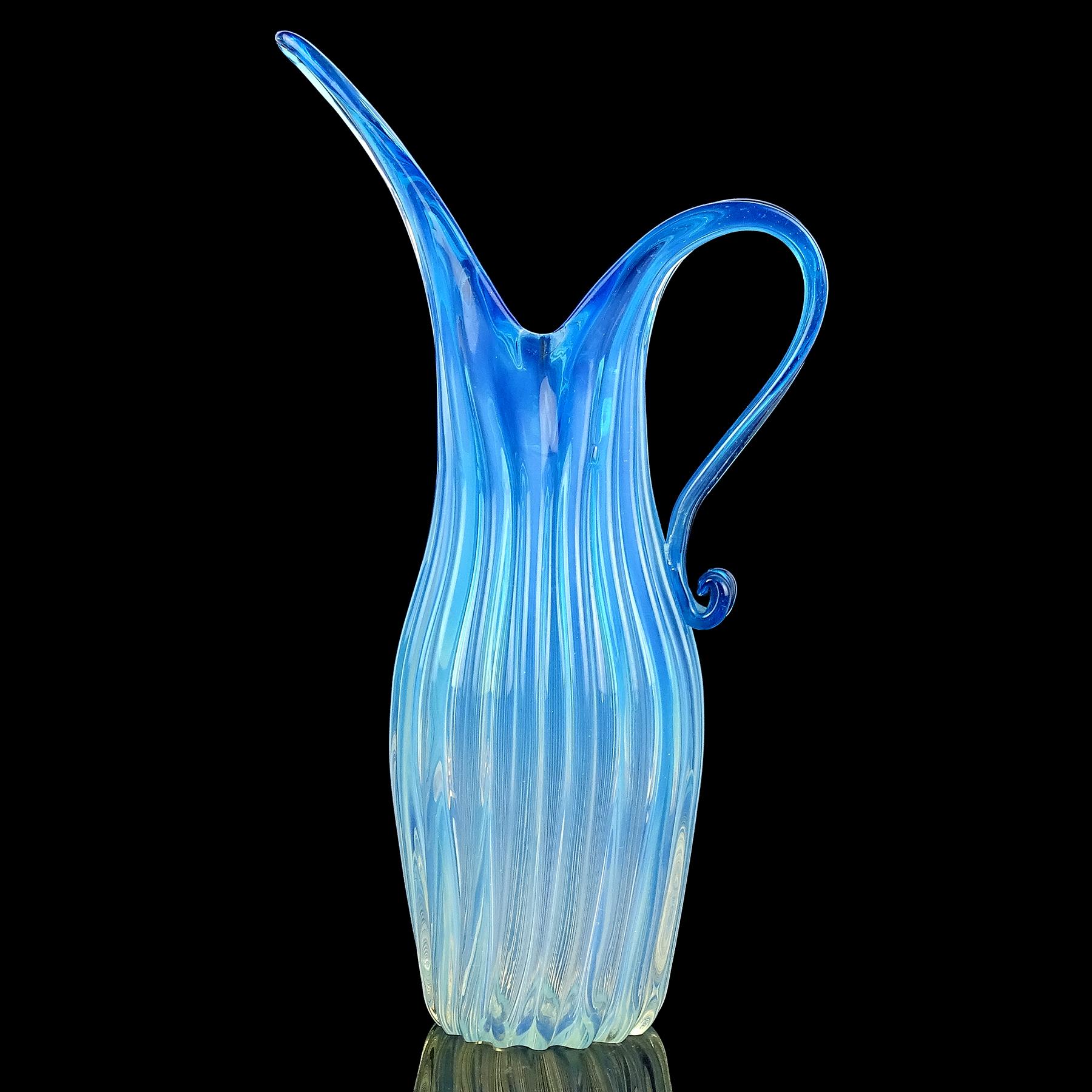 Beautiful large Murano hand blown opalescent blue to white Italian art glass pitcher or vase. Documented to the Fratelli Toso company. The piece is made with in the 
