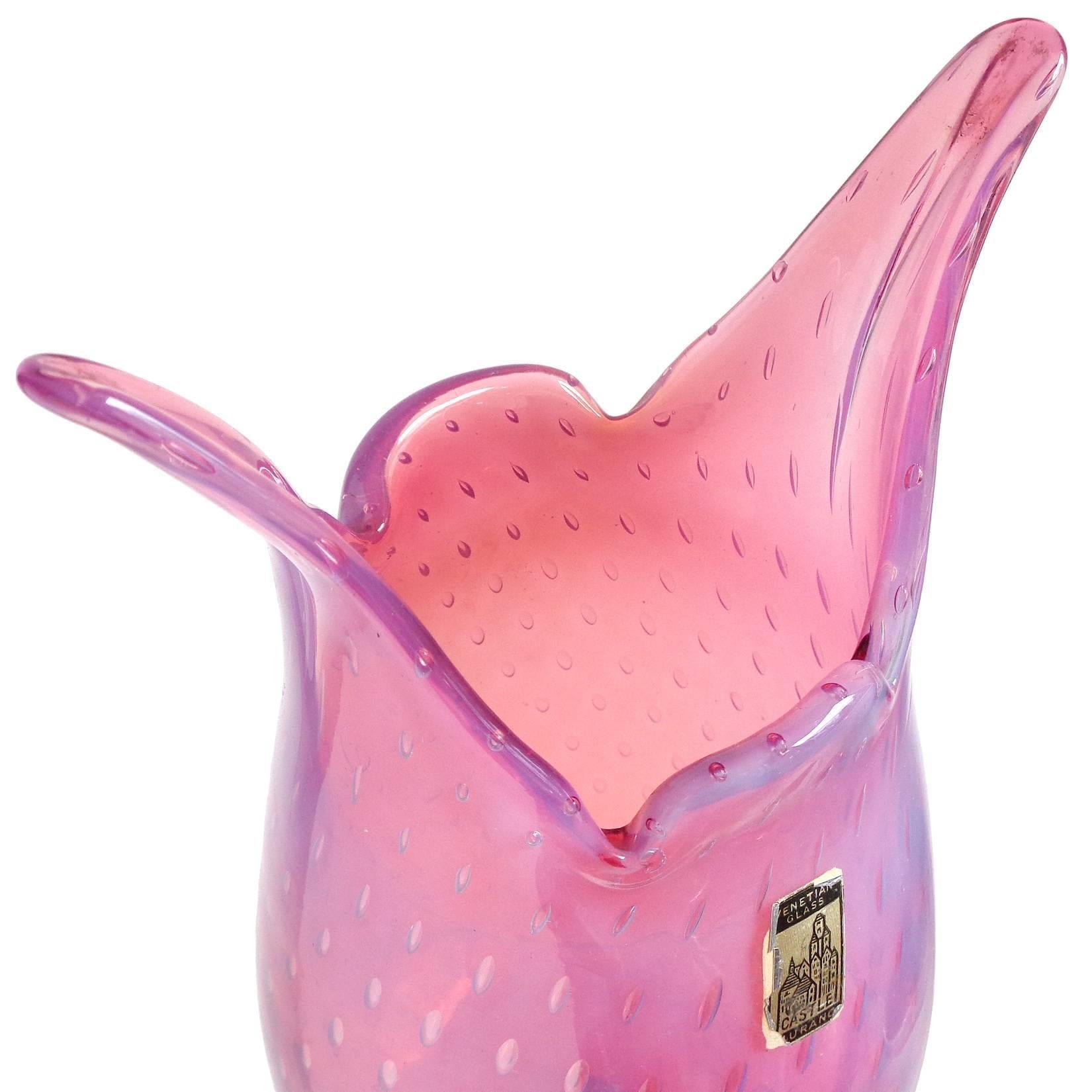 Beautiful vintage Murano hand blown opalescent pink and controlled bubbles Italian art glass flower vase. Documented to the Fratelli Toso company. It still retains two original labels, as shown. There is a 