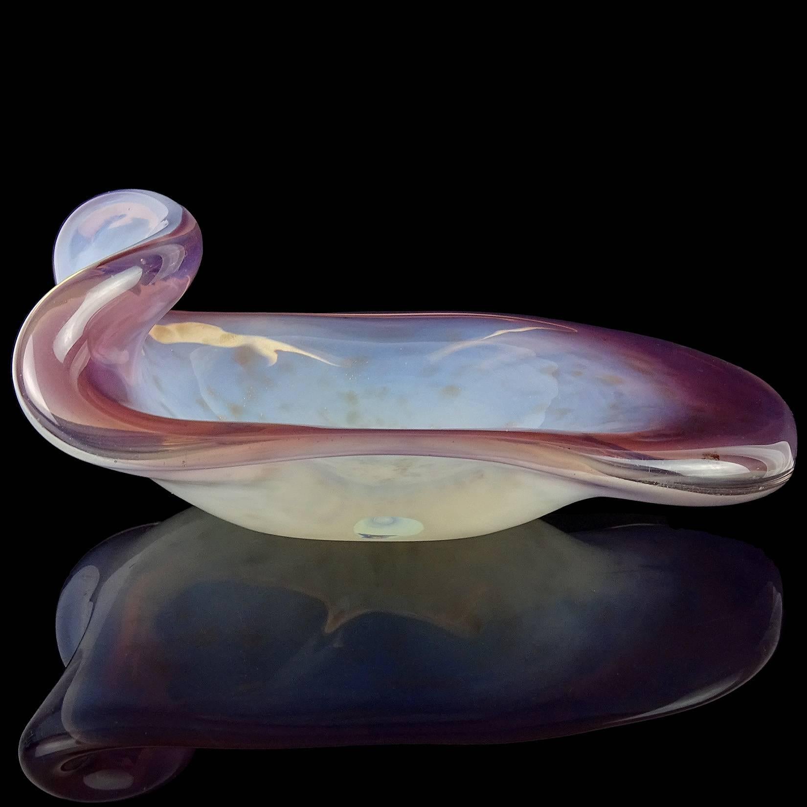 Beautiful vintage Murano hand blown lavender soft purple, white opal and copper aventurine flecks Italian art glass bowl. Documented to the Fratelli Toso company. It has a curled up rim, creating a unique shape. The aventurine pieces sparkle in the