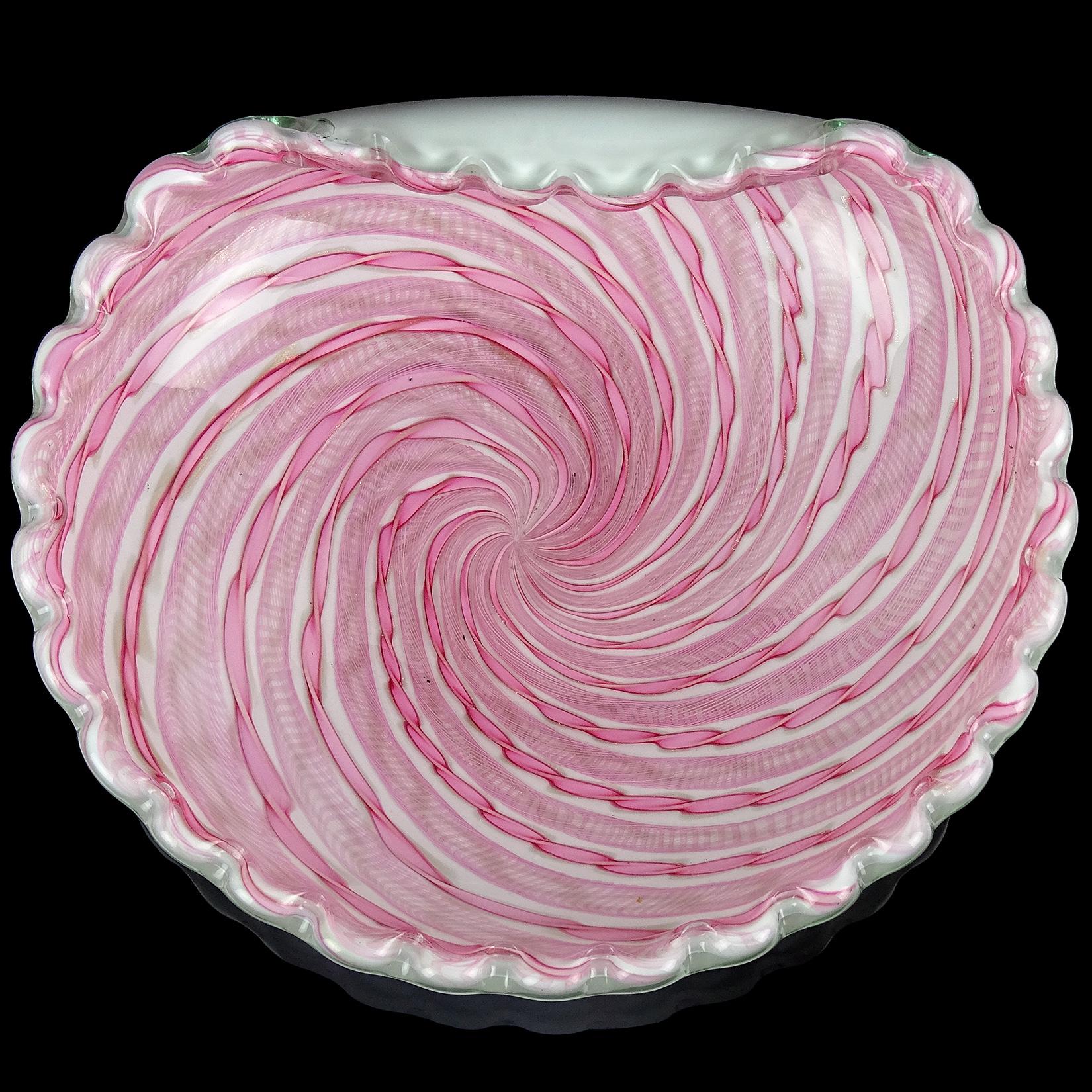 Beautiful Murano hand blown pink ribbons Italian art glass bowl. Documented to the Fratelli Toso company. Made with pink Latticino and pink Zanfirico with copper aventurine twisting ribbons. The bowl is case in white on the outside, making the