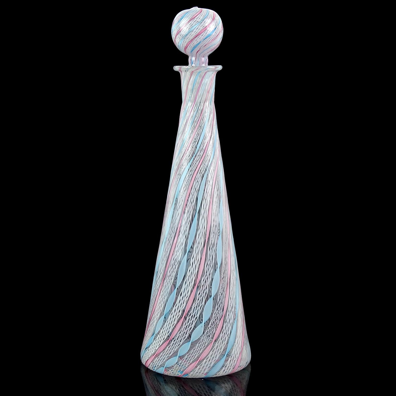 Beautiful vintage Murano hand blown pink, blue and white ribbons Italian art glass decanter. Documented to the Fratelli Toso company. The sky blue and light pink ribbons have a twist design, and the white Zanfirico have a net design. The colors