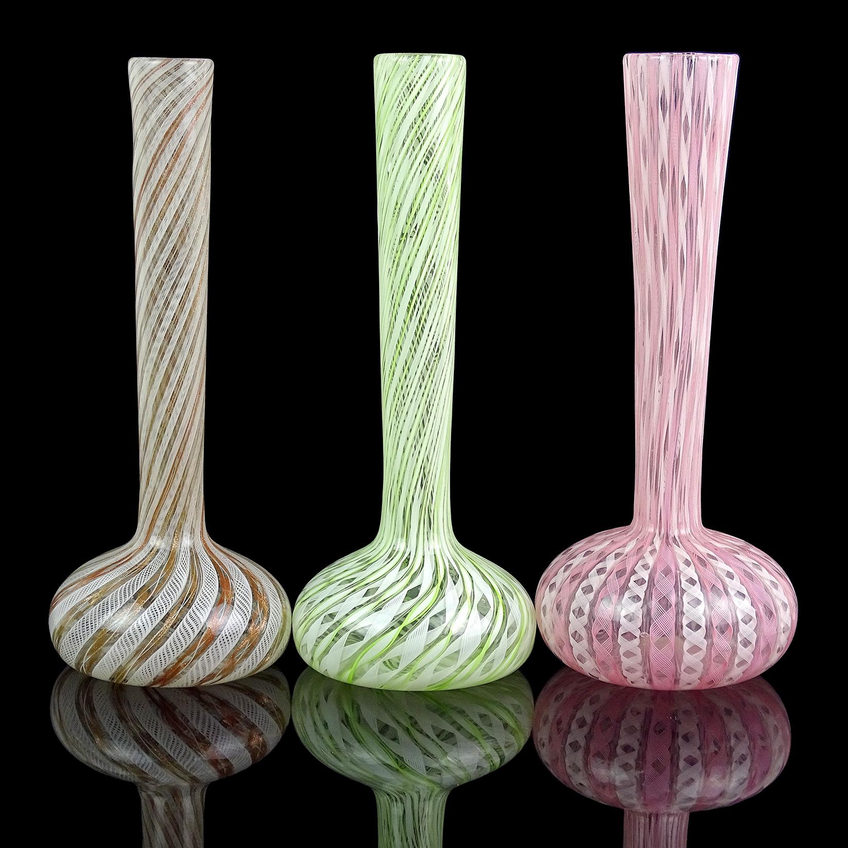 Priced per vase (3 colors available as shown). Beautiful vintage Murano hand blown Zanfirico ribbons art glass bud or specimen flower vases. Documented to the Fratelli Toso Company. Each has a different ribbon pattern. The bright lime green and