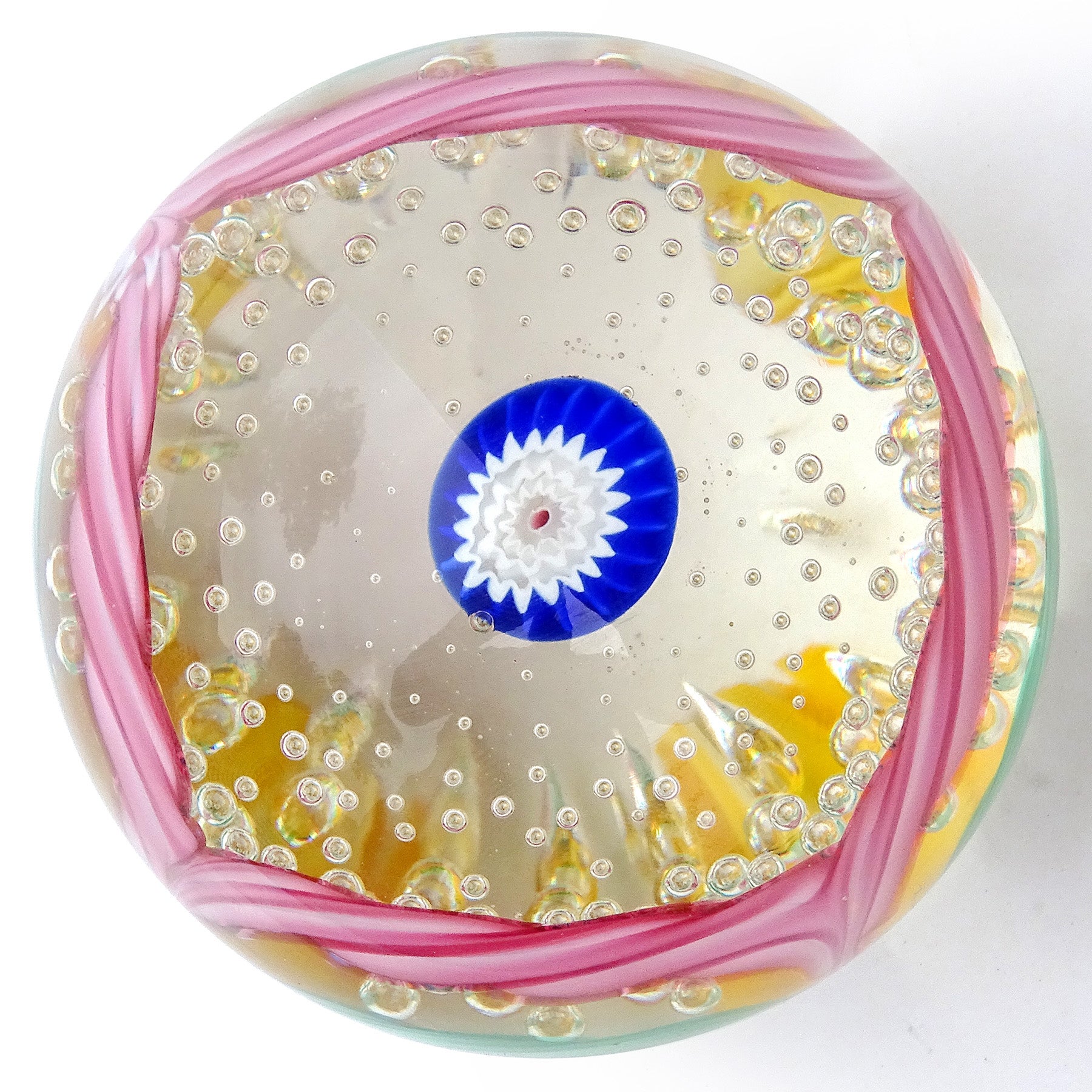 Beautiful and colorful vintage Murano hand blown blue, pink, green and golden yellow Italian art glass paperweight. Documented to the Fratelli Toso company. This paperweights are often referred to as 