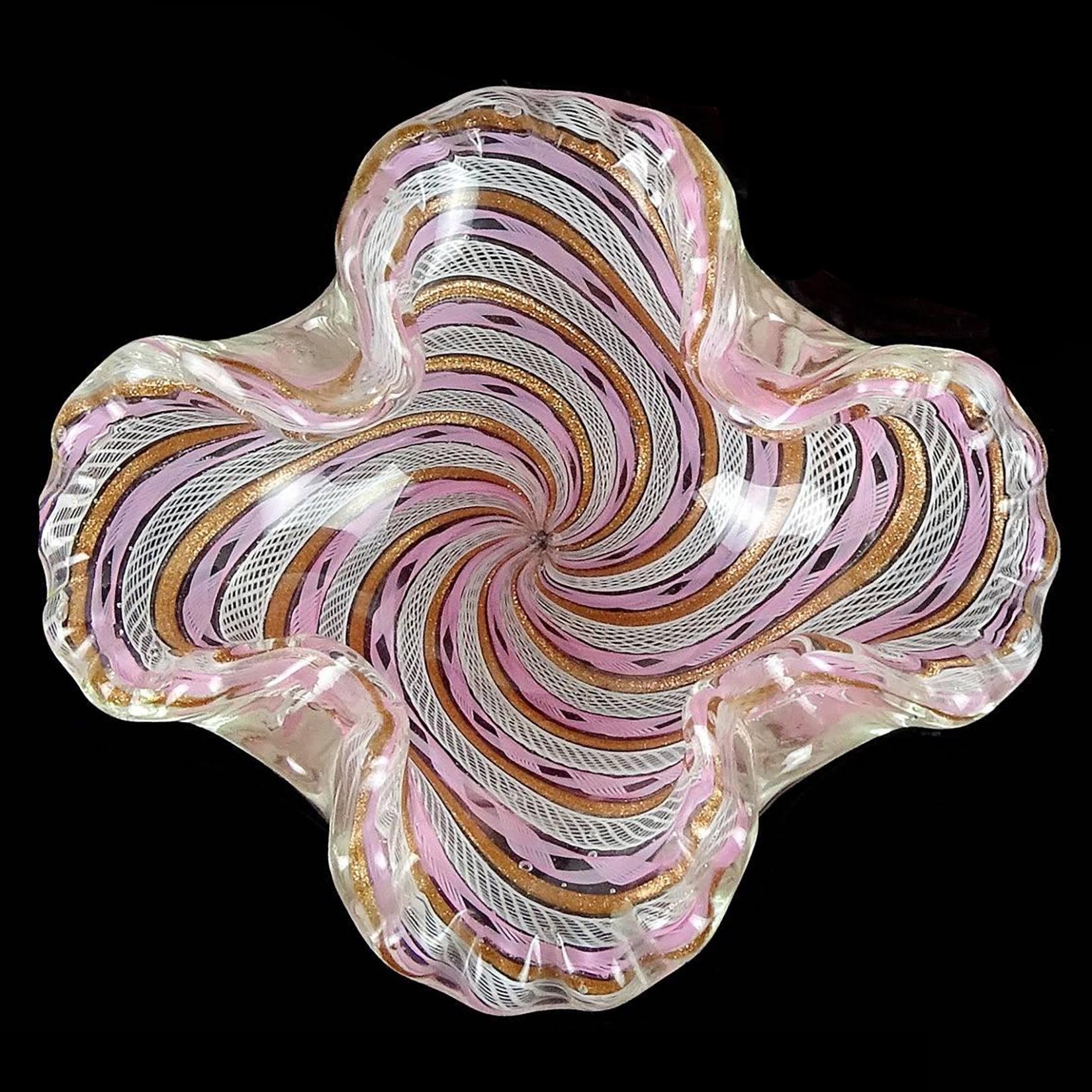 Beautiful vintage Murano hand blown pink, white and copper aventurine twisted Zanfirico ribbons Italian art glass decorative bowl. Documented to the Fratelli Toso company. Has a ruffled and folded in rim. Very intricate designs on the ribbons. Can