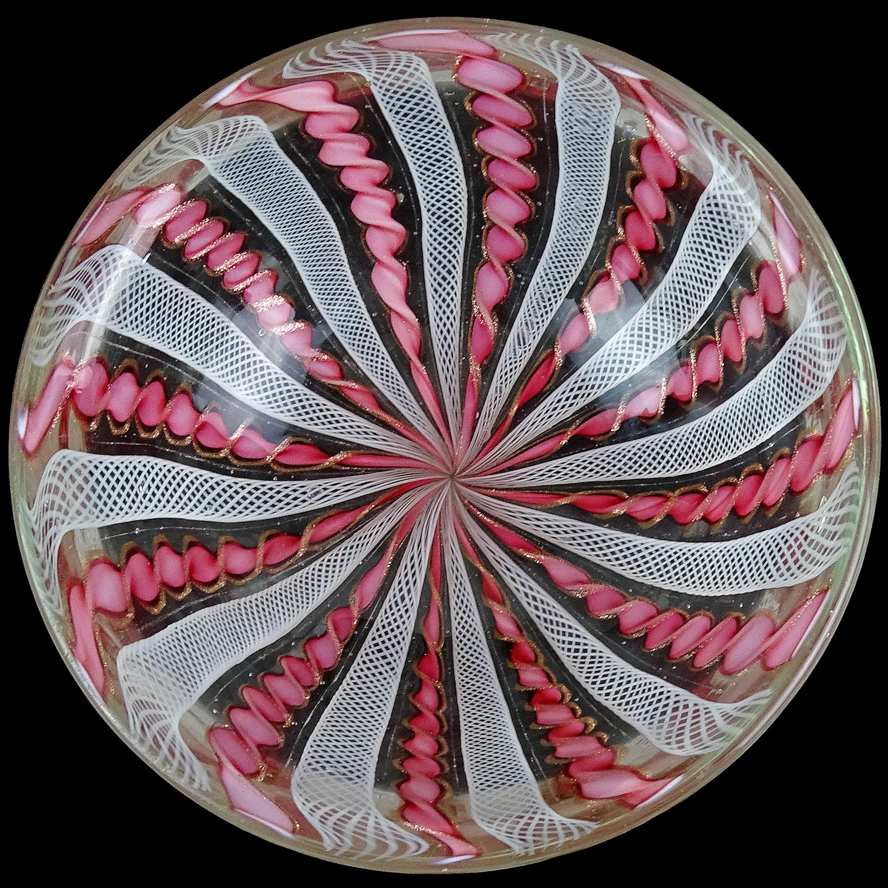 Beautiful vintage Murano hand blown pink, white and copper aventurine twisted Zanfirico ribbons Italian art glass decorative bowl. Documented to the Fratelli Toso company. The bowl has a circular shape, with alternating pink and white pattern. Very