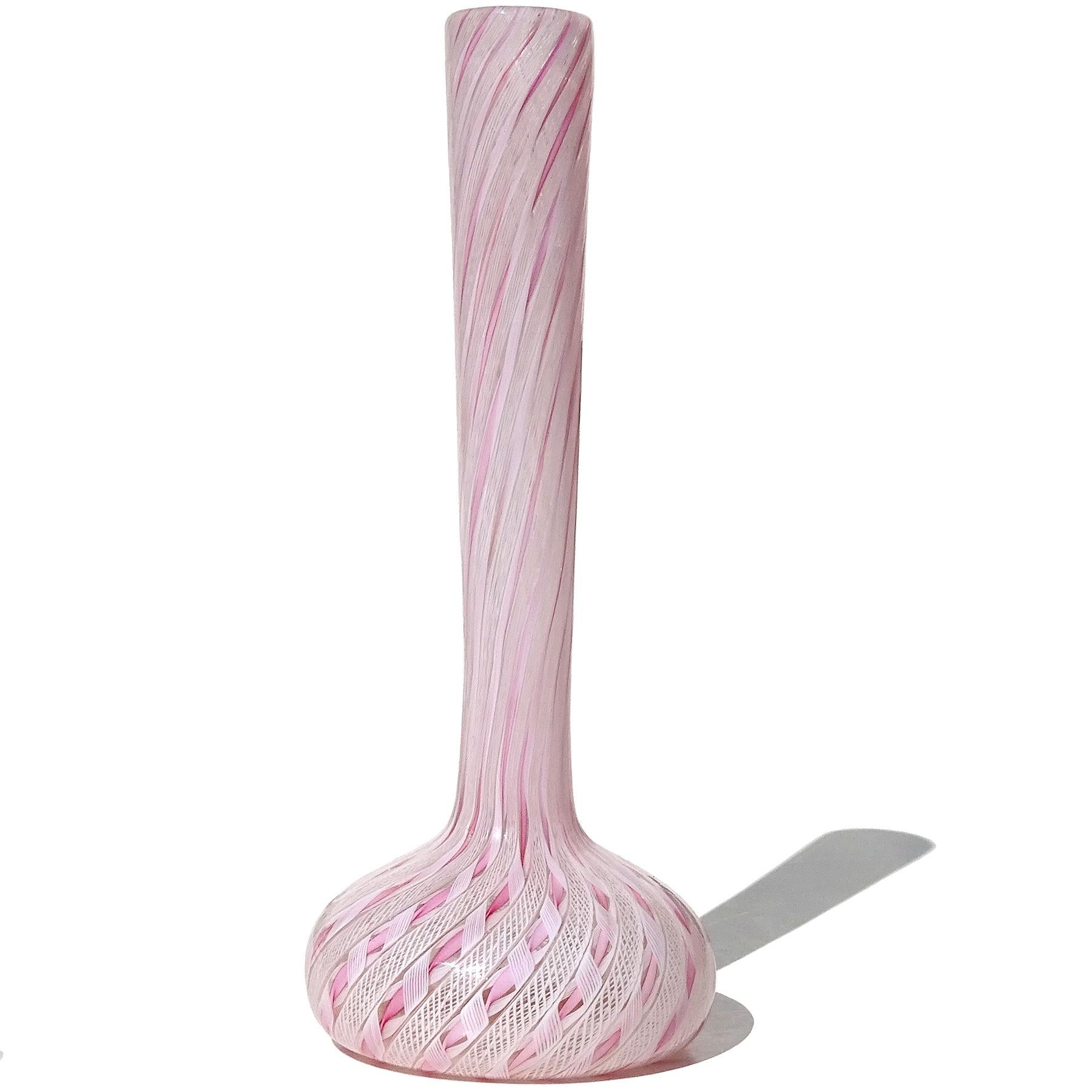 Beautiful vintage Murano hand blown pink and white ribbons Italian art glass soliflore flower vase. The piece is documented to the Fratelli Toso company. The vase is made with intricate swirling pink and white net 