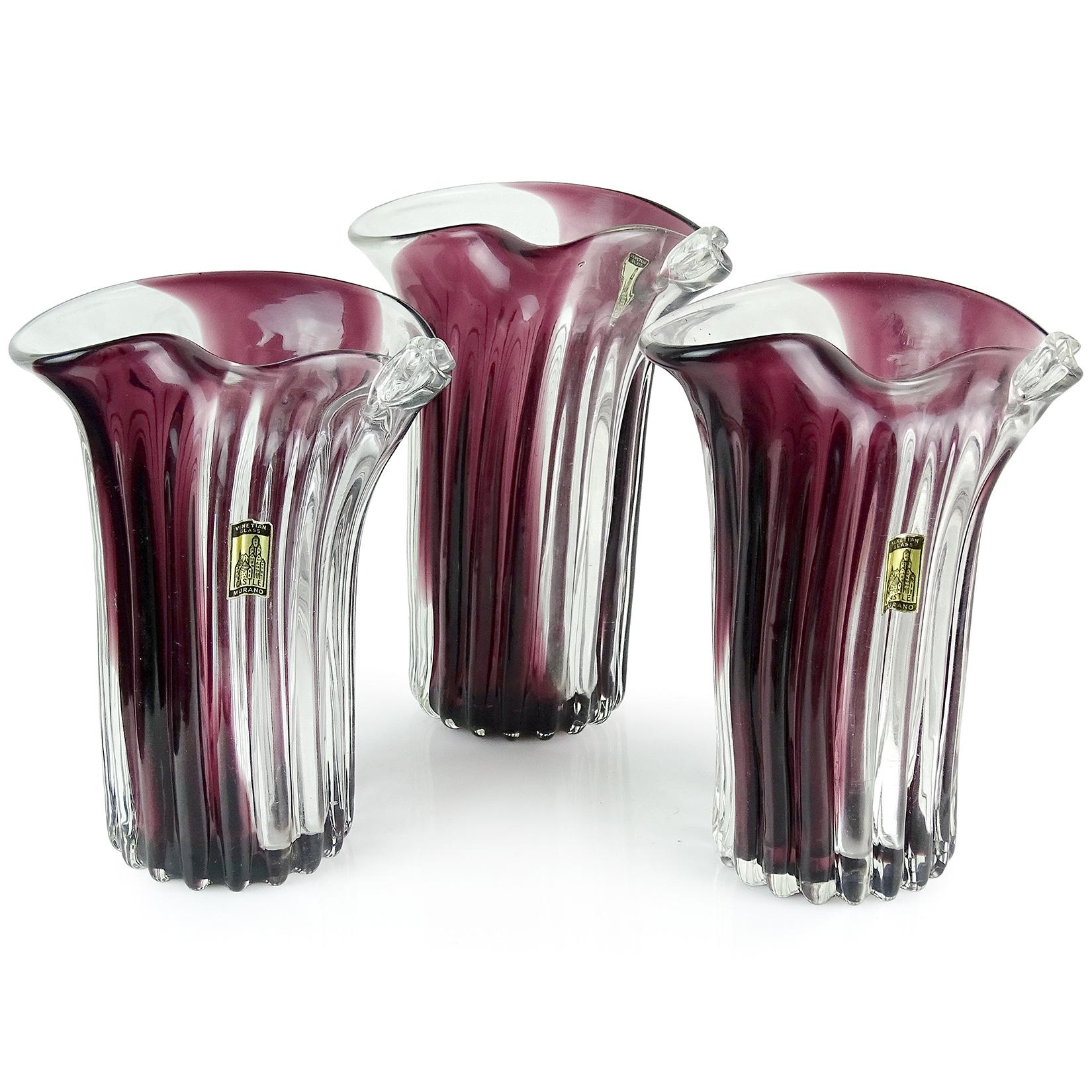 Priced per item (3 available as shown). Beautiful vintage Murano handblown ribbed pattern and purple stripe Italian art glass flower vases. Documented to the Fratelli Toso company. Published, with original labels. They have a flared rim with scroll
