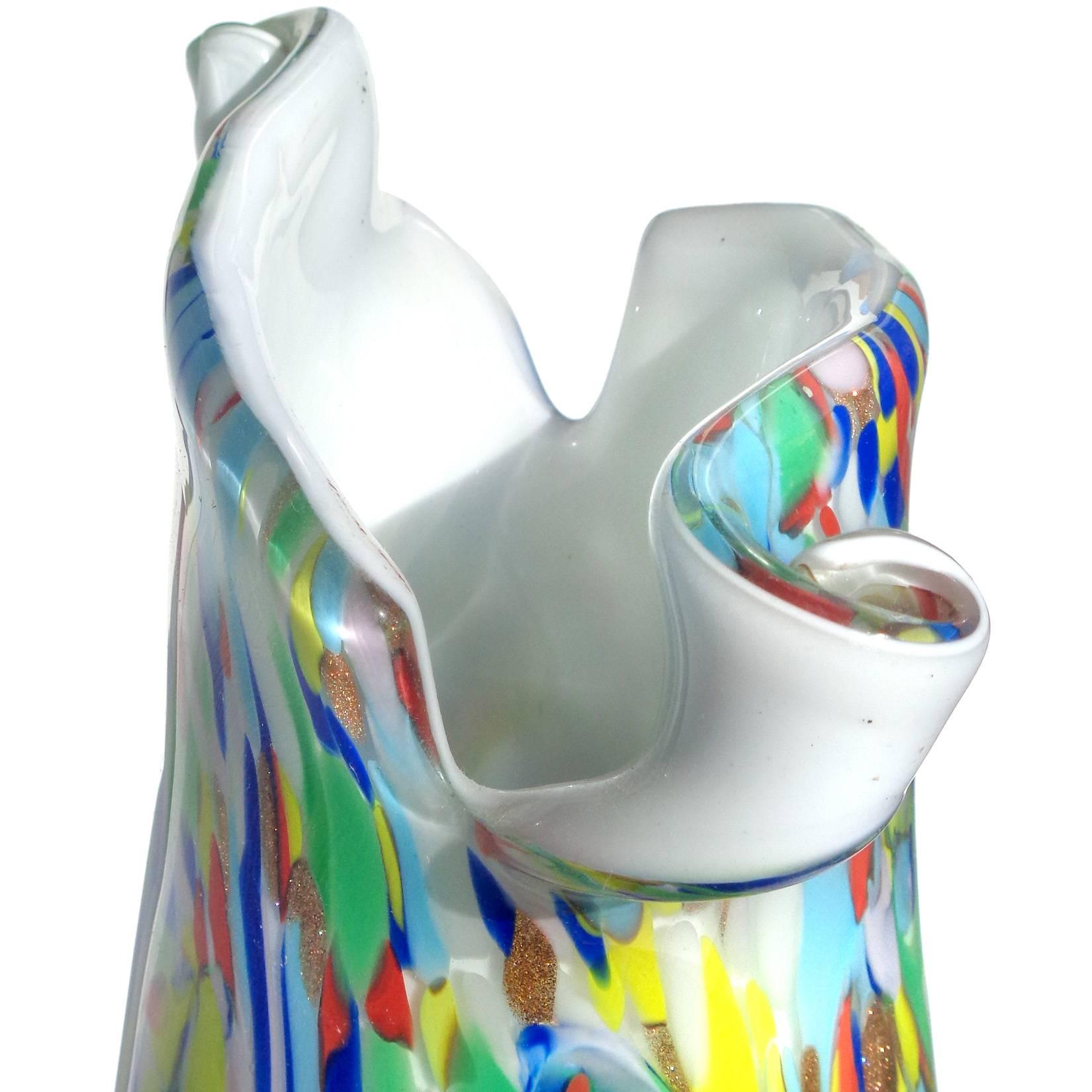 Beautiful large Murano hand blown rainbow color swirls over white Italian art glass flower vase with scissor cut rim. Documented to the Fratelli Toso company, in the 