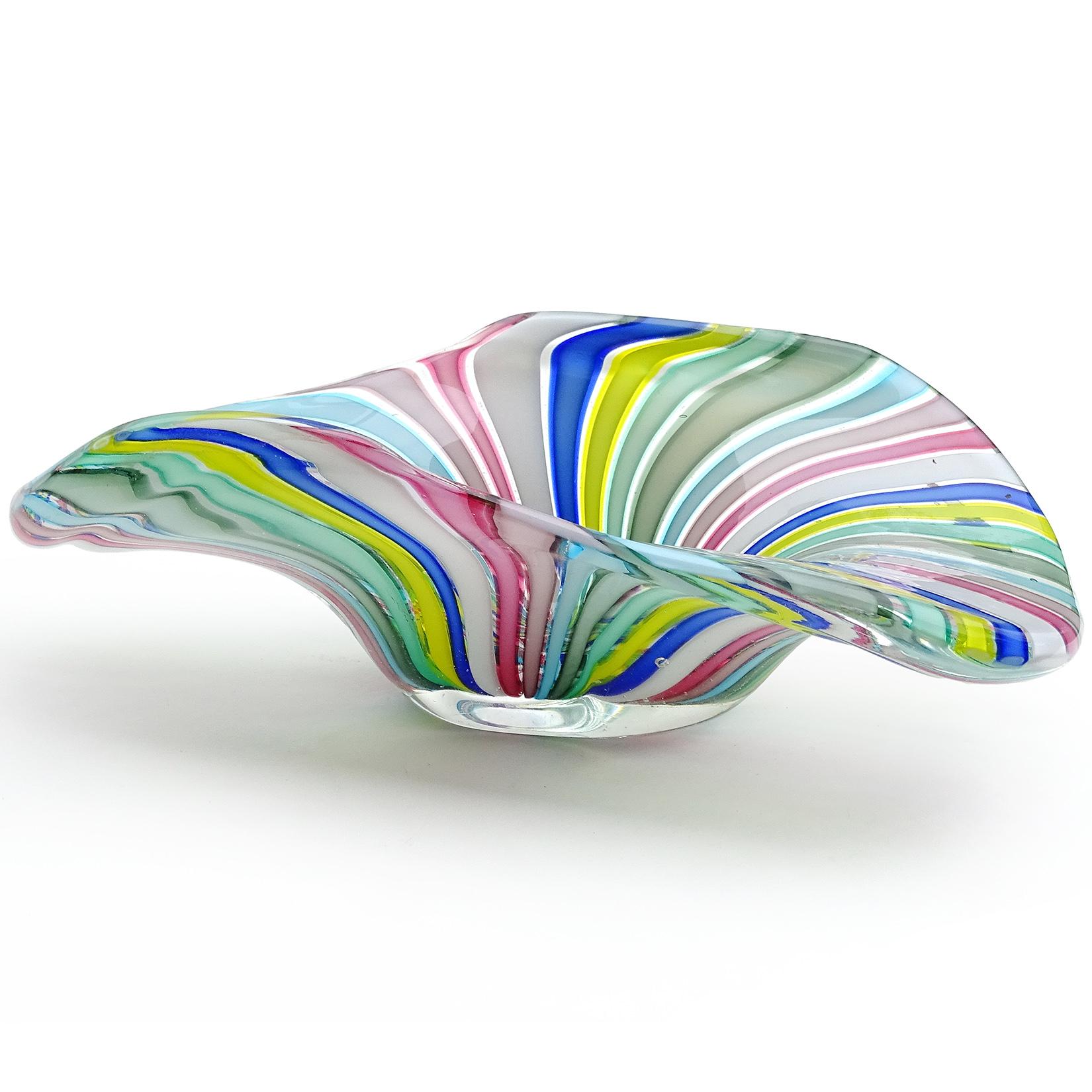 Colorful Murano handblown rainbow Filigrana ribbons Italian art glass bowl. Documented to designer Fratelli Toso. It has an organic shape, with white, cobalt blue, yellow, teal, pink, soft pink, gray and light blue colors. Great statement on any