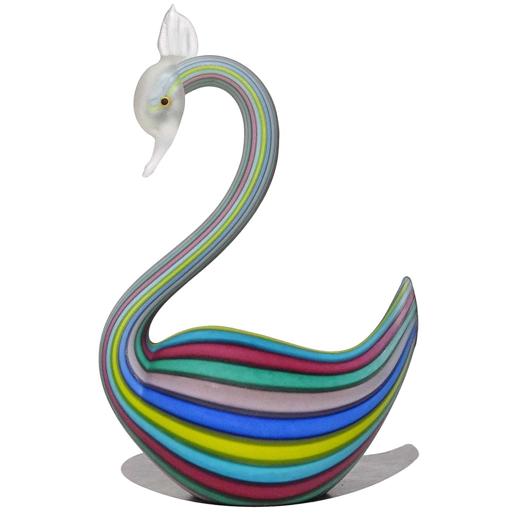Beautiful vintage Murano hand blown rainbow Filigrana ribbons with satin surface Italian art glass swan bird figurine. The piece is documented to the Fratelli Toso company, with silver and blue shield import label still attached. It reads 