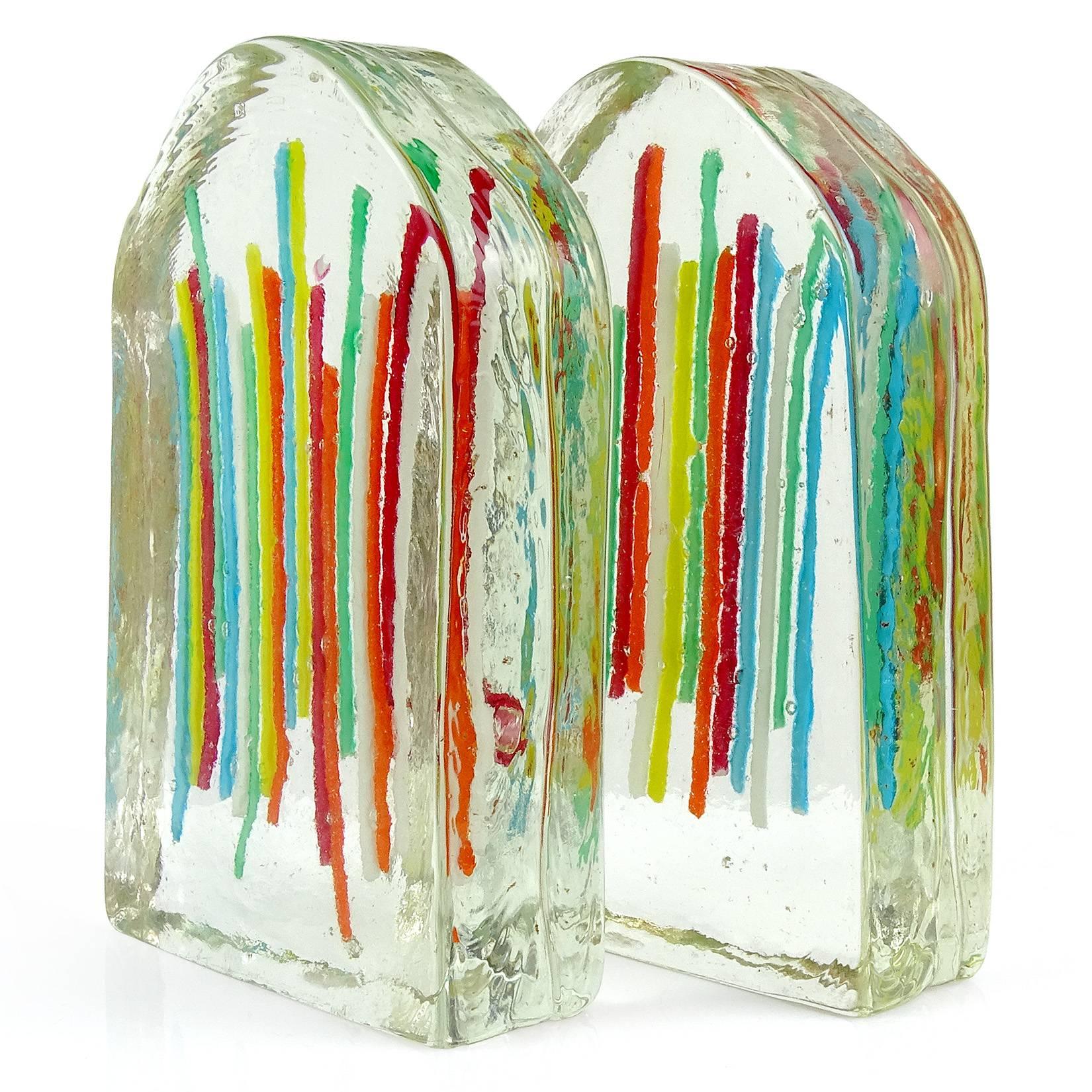 Beautiful Murano handblown rainbow color ribbons Italian art glass block bookends. Documented to the Fratelli Toso Company. They still have partial 