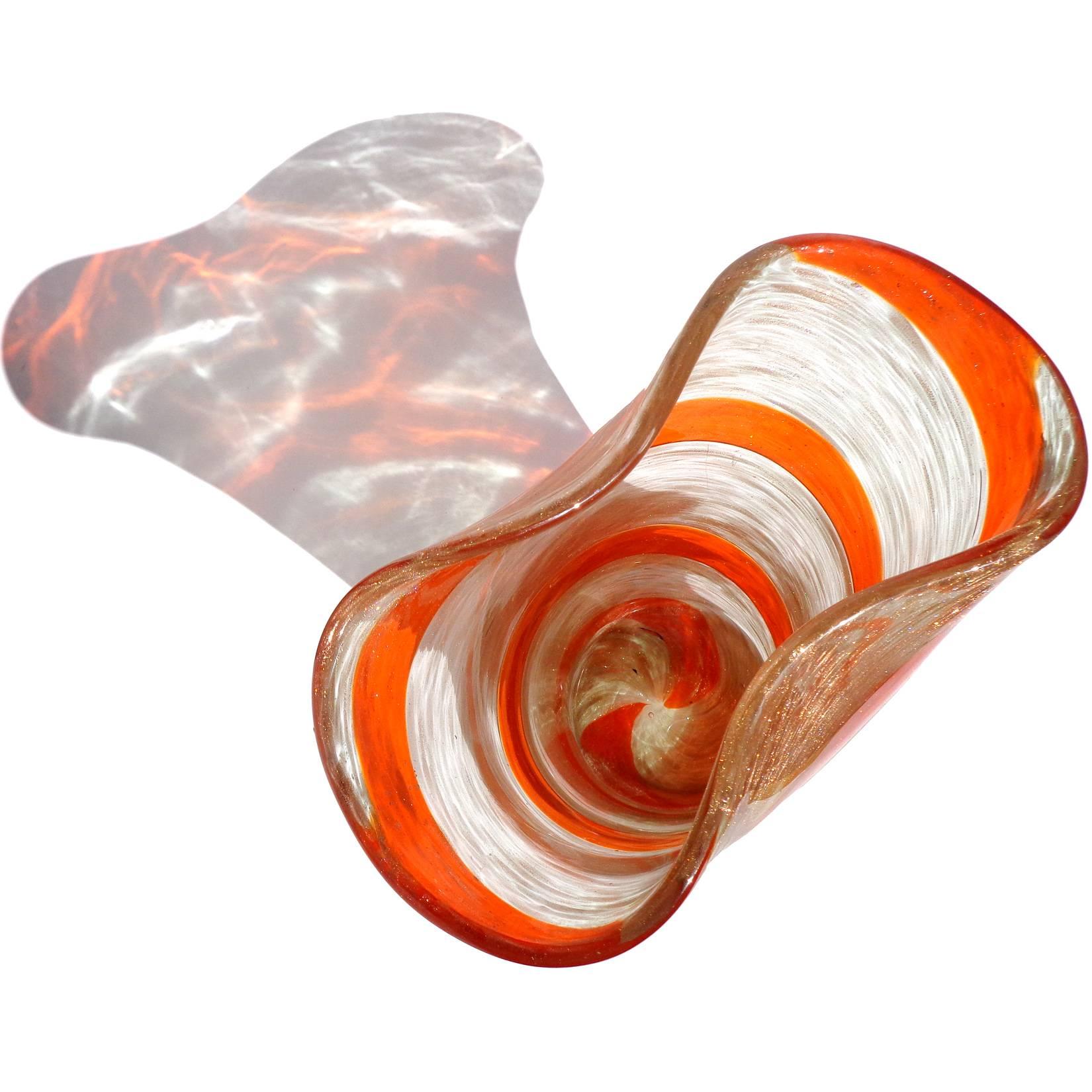 Beautiful large vintage Murano hand blown red orange candy stripe ribbon and aventurine flecks Italian art glass flower vase. Documented to the Fratelli Toso company, circa 1950s. The piece has a pinched rim, and is profusely covered in copper