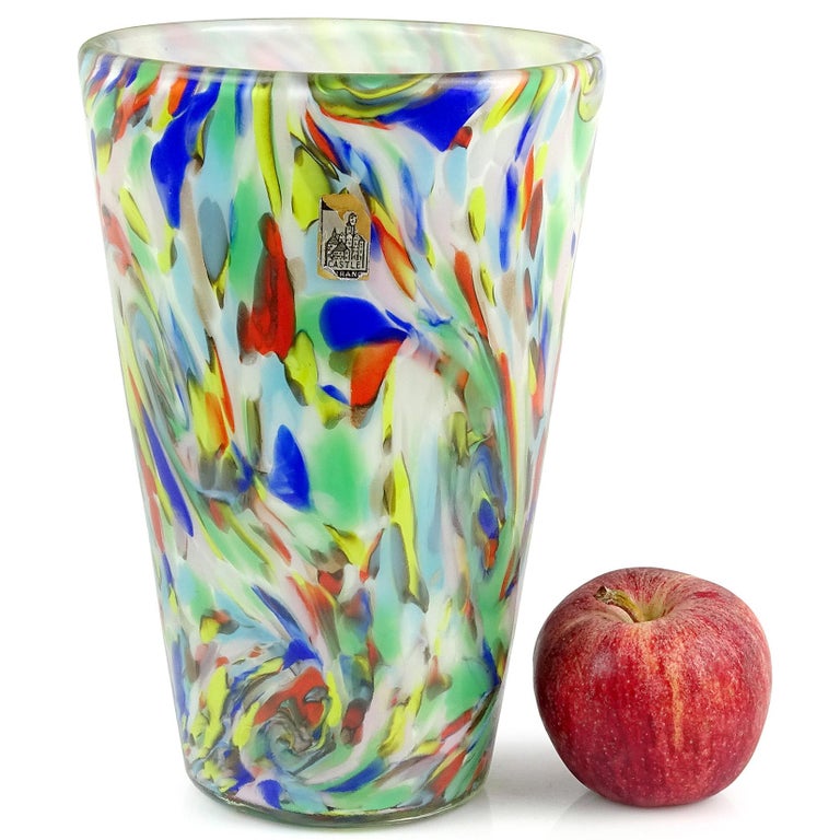 Beautiful, large vintage Murano handblown rainbow color swirls over white Italian art glass flower vase. Documented to the Fratelli Toso company, in the 