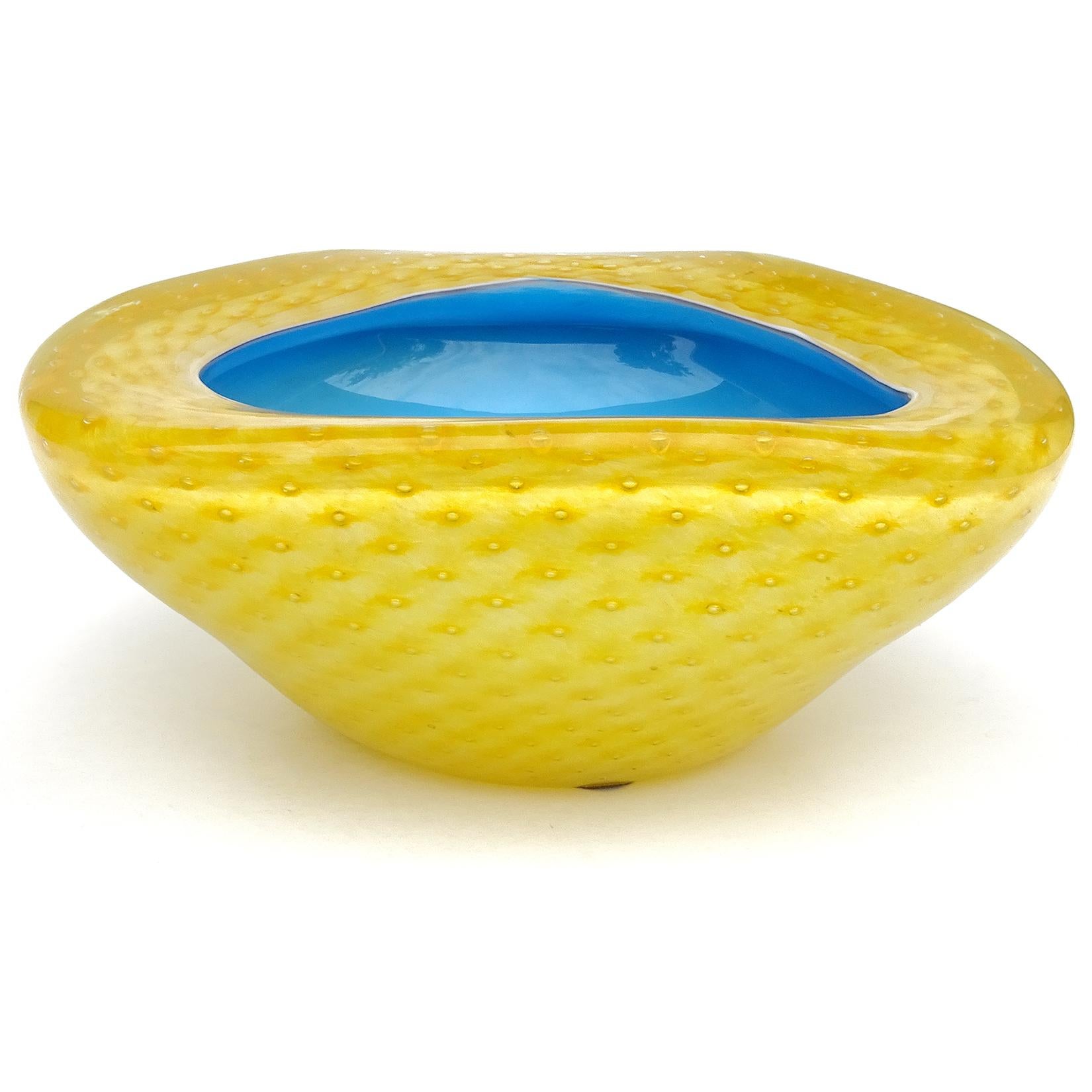 Beautiful vintage Murano hand blown yellow over blue, and controlled bubbles Italian art glass bowl / ashtray. Documented to the Fratelli Toso company, circa 1950-1960. The bowl still retains an original, but worn, 