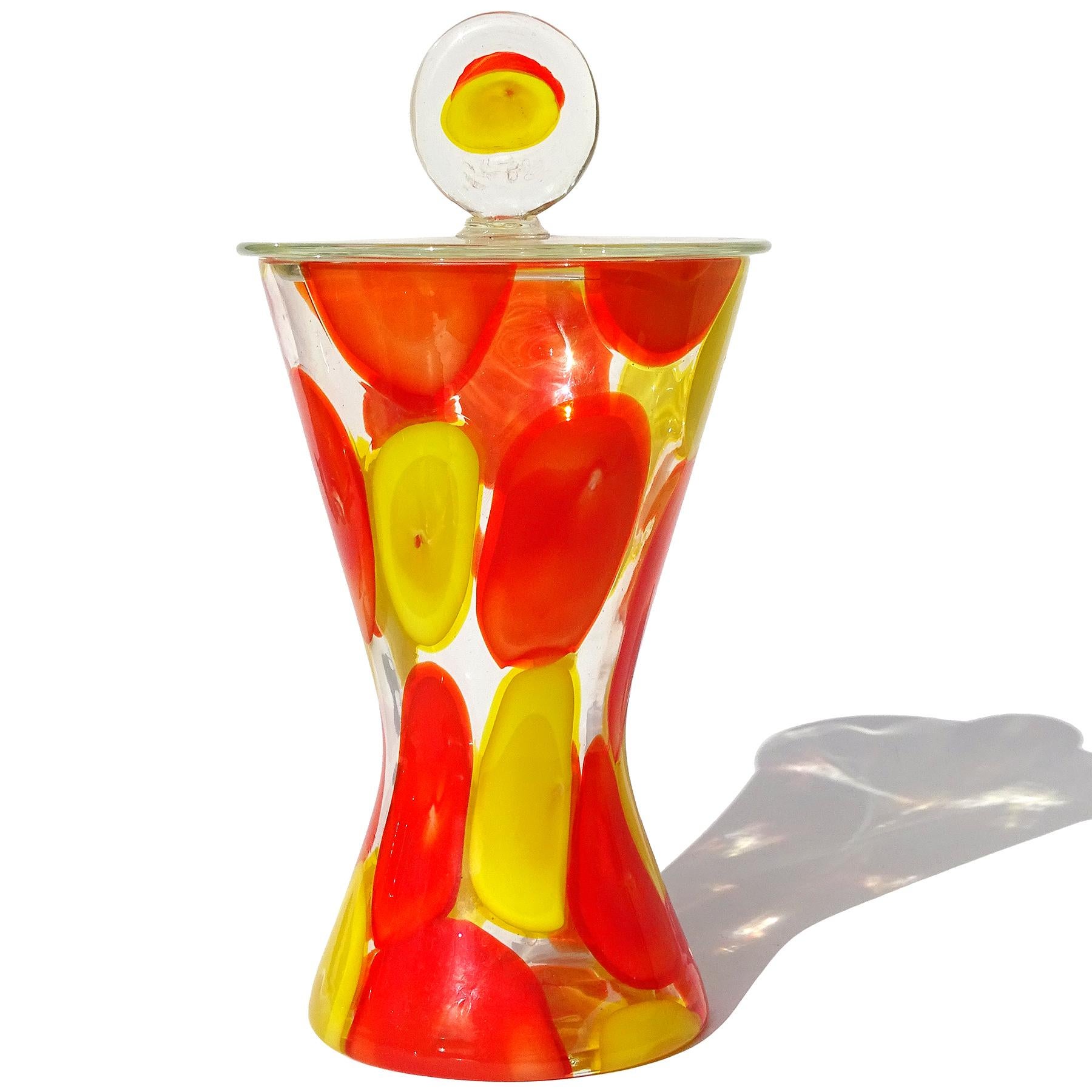 Beautiful and very rare Murano hand blown bright orange and yellow spots Italian art glass lidded candy jar / container. Documented to designer Ermanno Toso for the Fratelli Toso company, circa 1962. Published in the Fratelli Toso book (see photo).