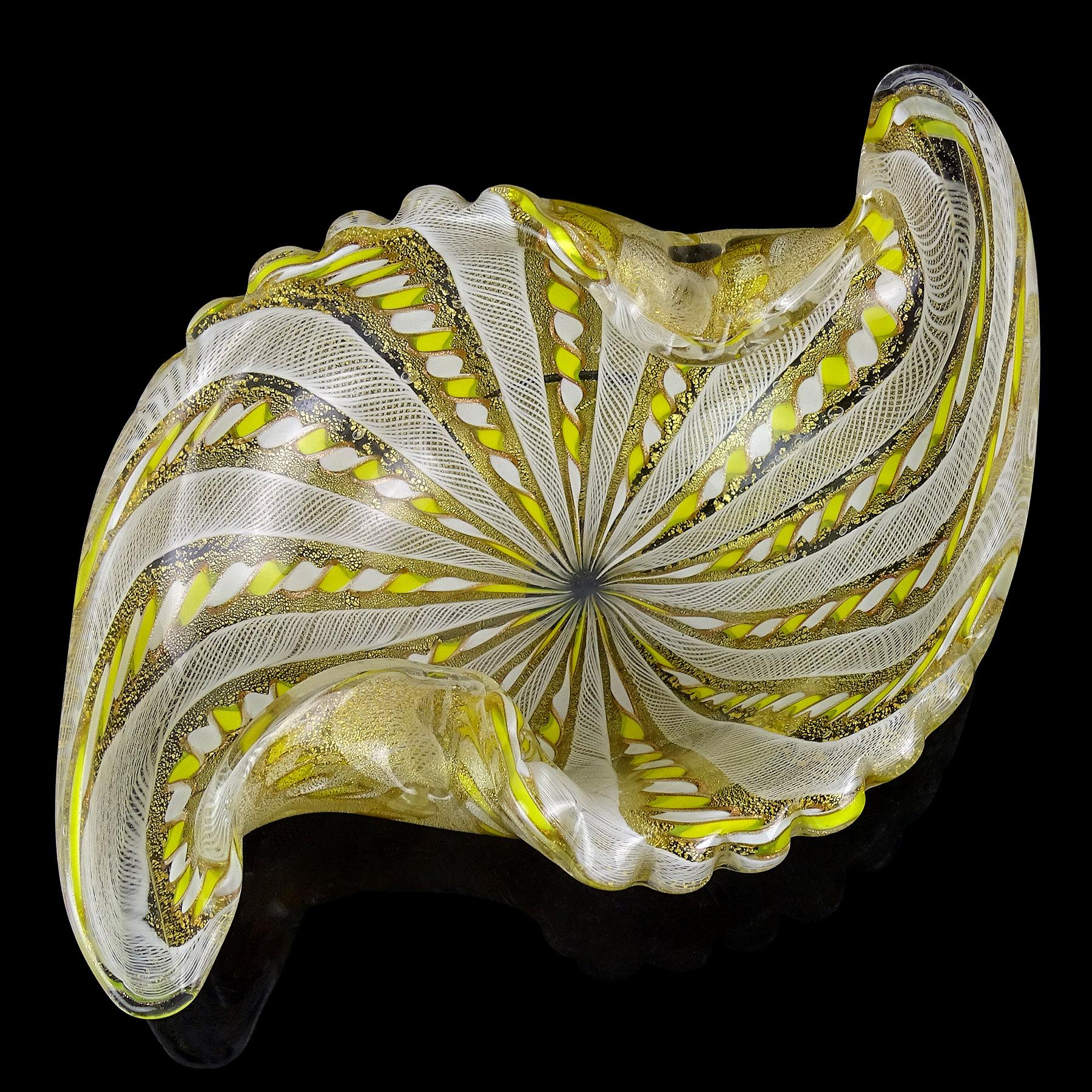 Beautiful, vintage Murano hand blown yellow, white and gold flecks Italian art glass center piece bowl. Documented to the Fratelli Toso company. The bowl has a scalloped rim, with 2 decorative folds and pulled sides in a unique shape. It has white