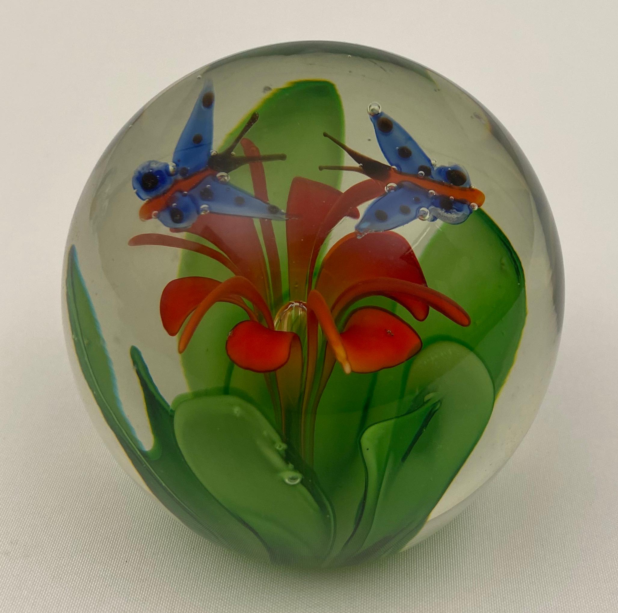 A magnificent limited edition paperweight attributed to Fratelli Toso.  Large and showy with great bright colors of red, blue and green.

Approximately 3 inches in diameter by 3 inches in height

Will enhance any desk or table. 