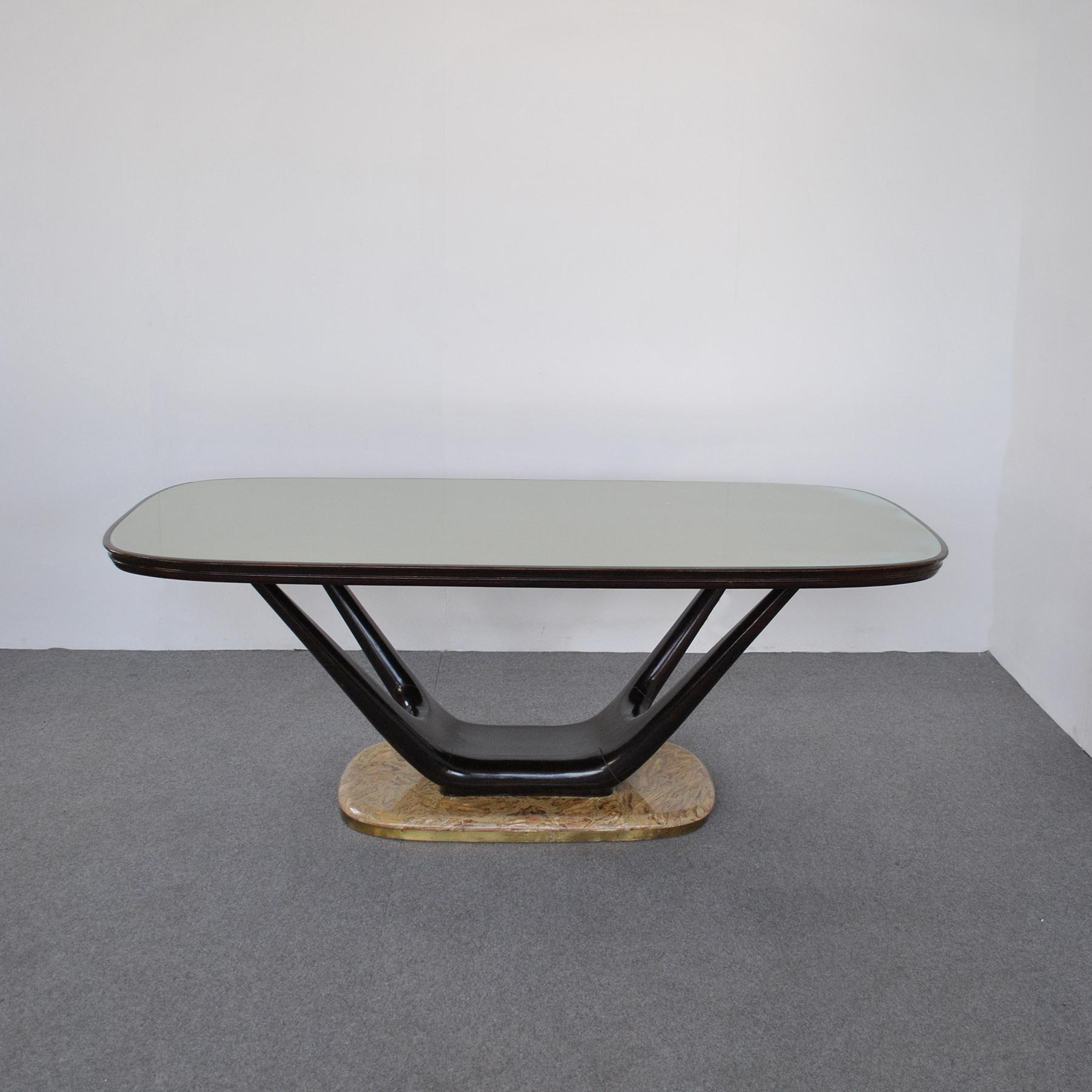 Fratelli Turri Milano project Vittorio Dassi (Milan, 1893-1973), around the 1960s. Mid-century dining table in lacquered rosewood and marble, the rectangular top with rounded edges inlaid with white marble and supported by sculptural wooden armrests