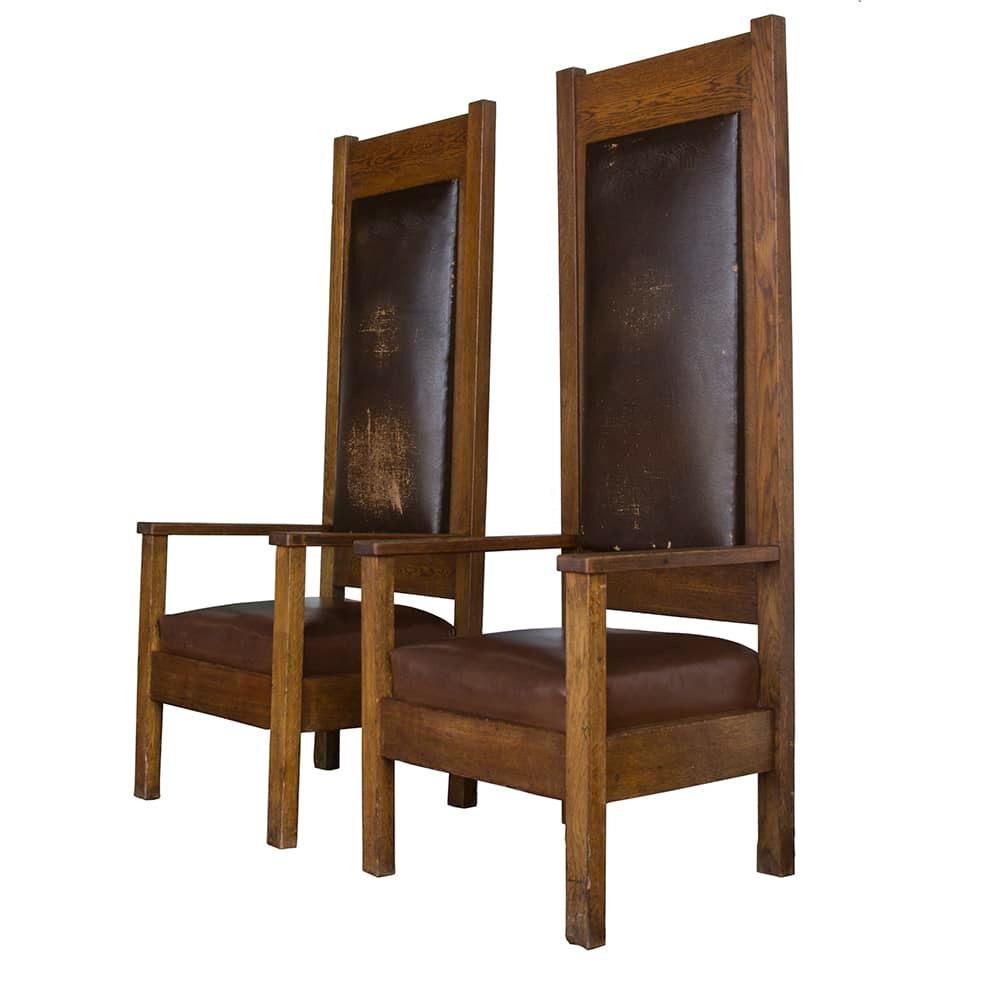 This set of stately chairs have an air of unadorned eminence. Crafted from heavy quarter sawn oak with their original leather upholstery, these chairs are handsome and large without being overpowering.