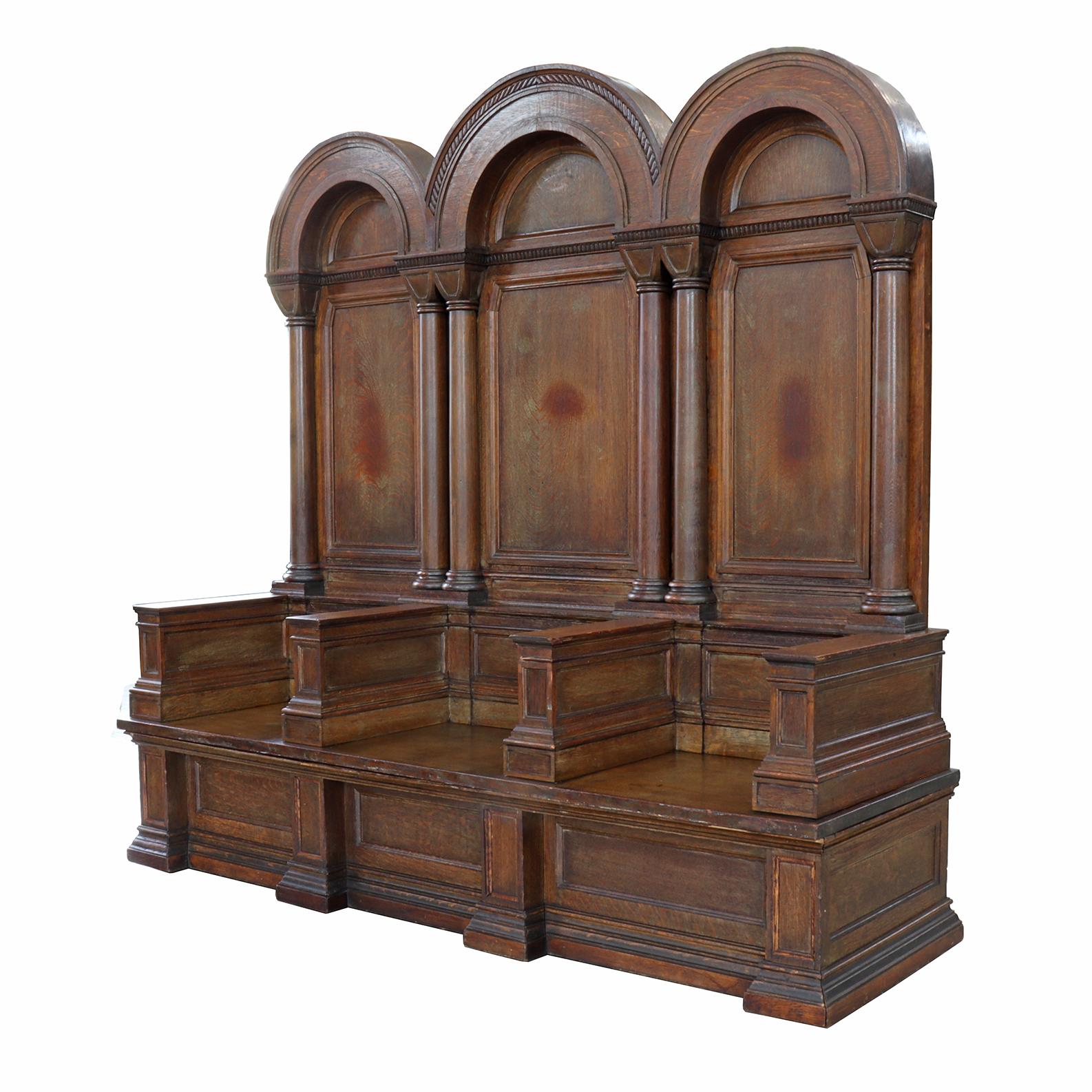 Salvaged out from an east coast fraternal lodge, this piece exudes a certain gravitas in its resolute and imposing form. Columnar accents and some restrained accent molding are the only decorative details apart from the distinctive paneling.
