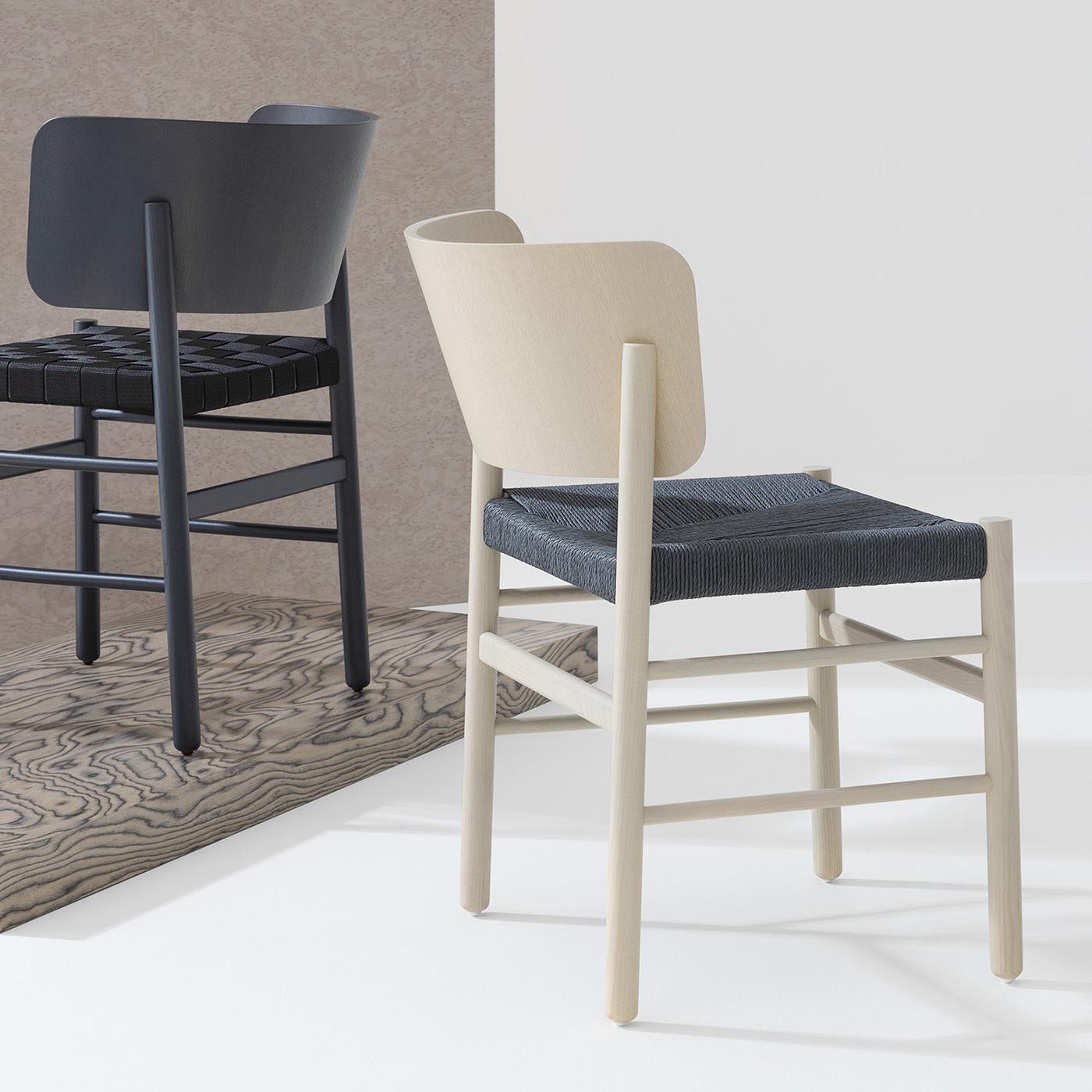 Smartly reprocessing a traditional design in an innovative way, this superb chair designed by Emilio Nanni manages to upgrade the aesthetic of any decor without stealing the scene. The sleek frame comprising the enveloping, open backrest is
