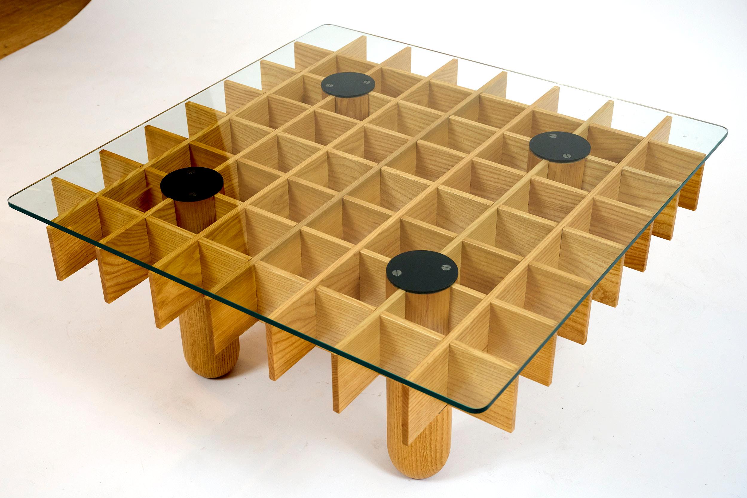 Square coffee table Gian Franco Frattini

Made in small numbers by cabinet maker Pierluigi Ghianda and distributed by Knoll International.

Ash, glass and laquered steel

Table is easily dismantled for shipping.

