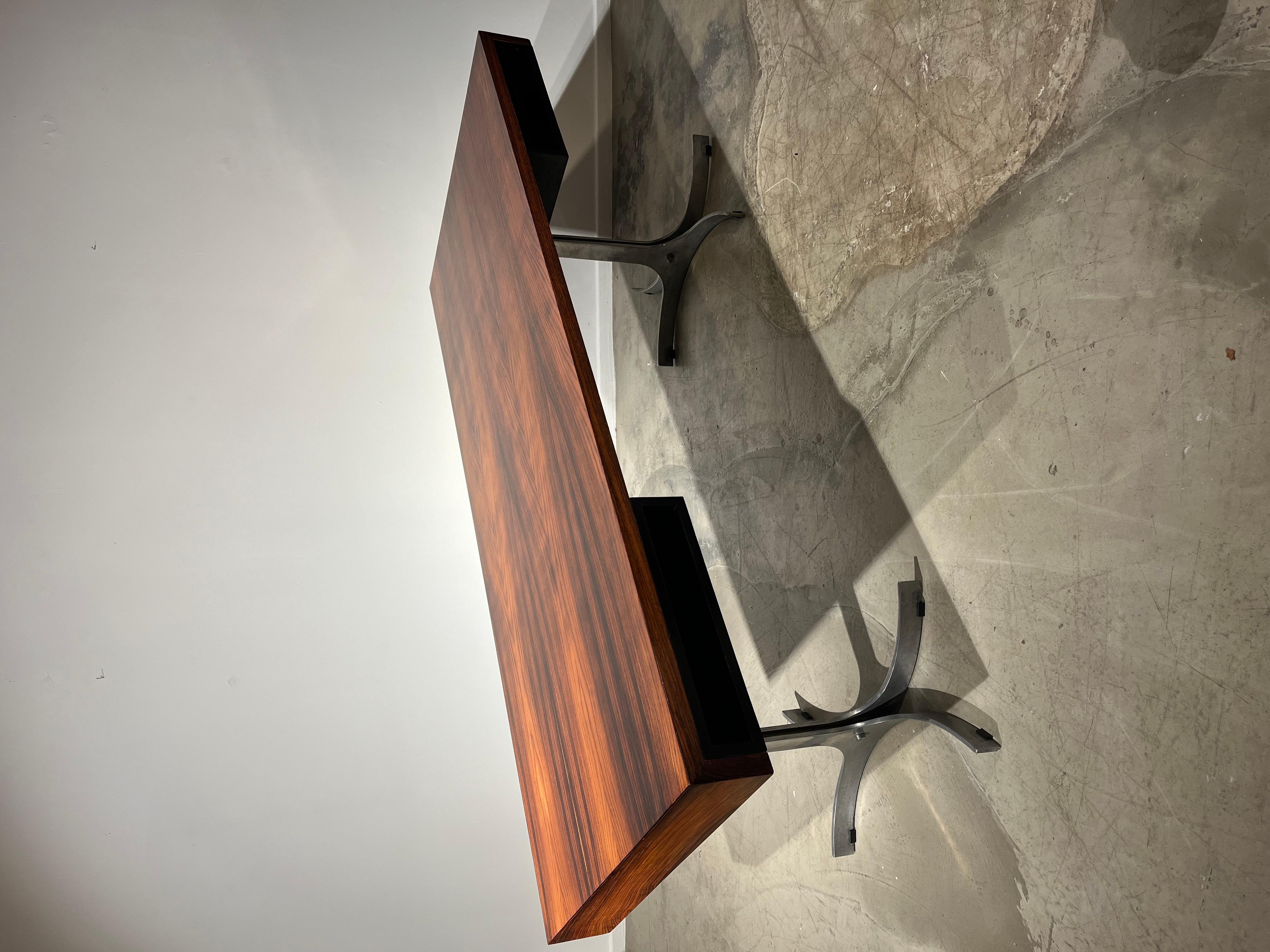 Elegant writing desk by Arredamenti with wood top hiding 2 black compartments and chromed legs.