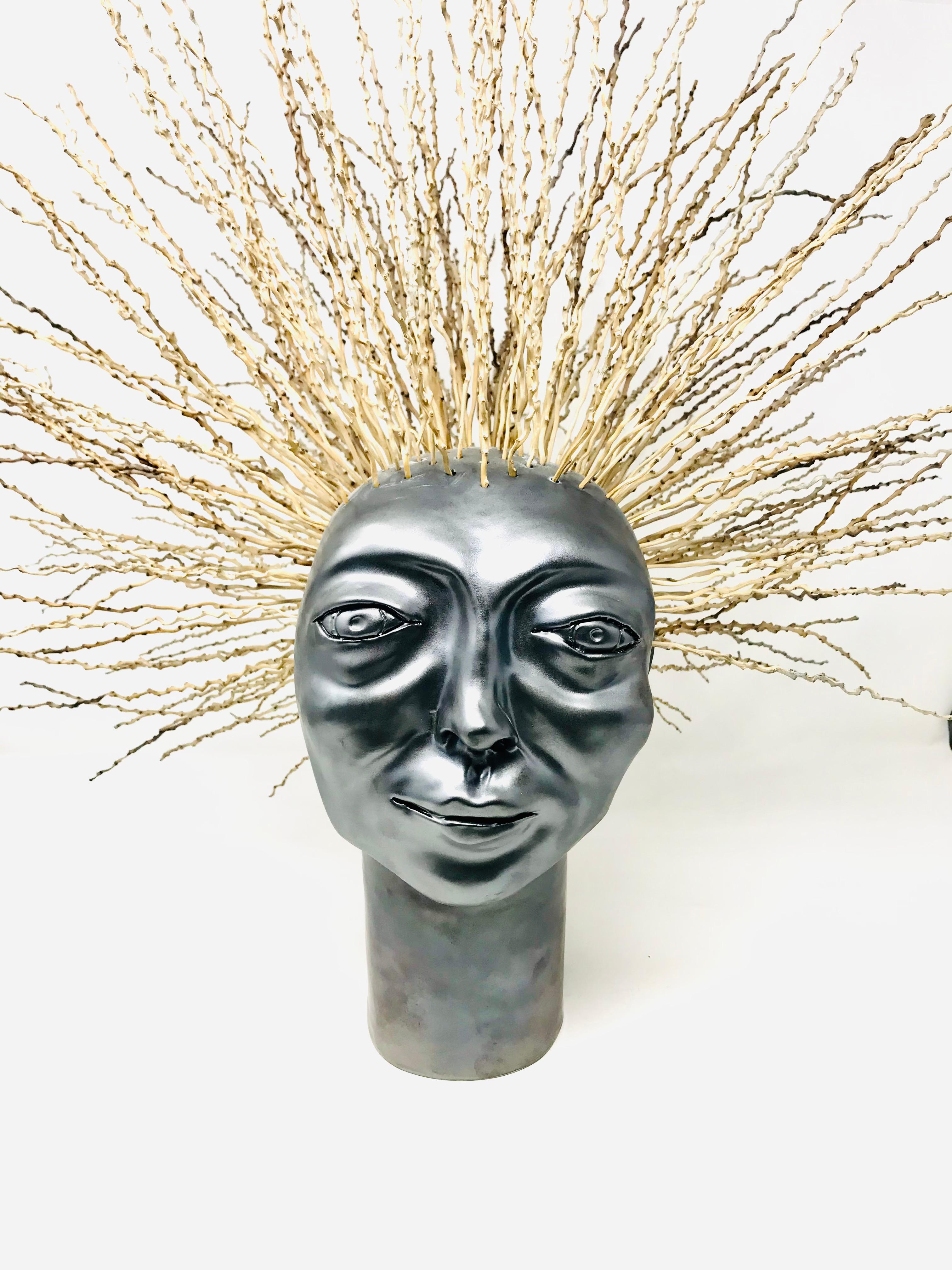 This Curly Head Sculpture by Freaklab fully represents the meaning of his art and continuous research and the technique of majolica and terracotta.
The sculpture is enriched with palm wood that forms the hair.
The theme is that of the identity