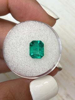 Freckled Bluish Green 2.12 Carat Emerald Cut Colombian Emerald Gem - May