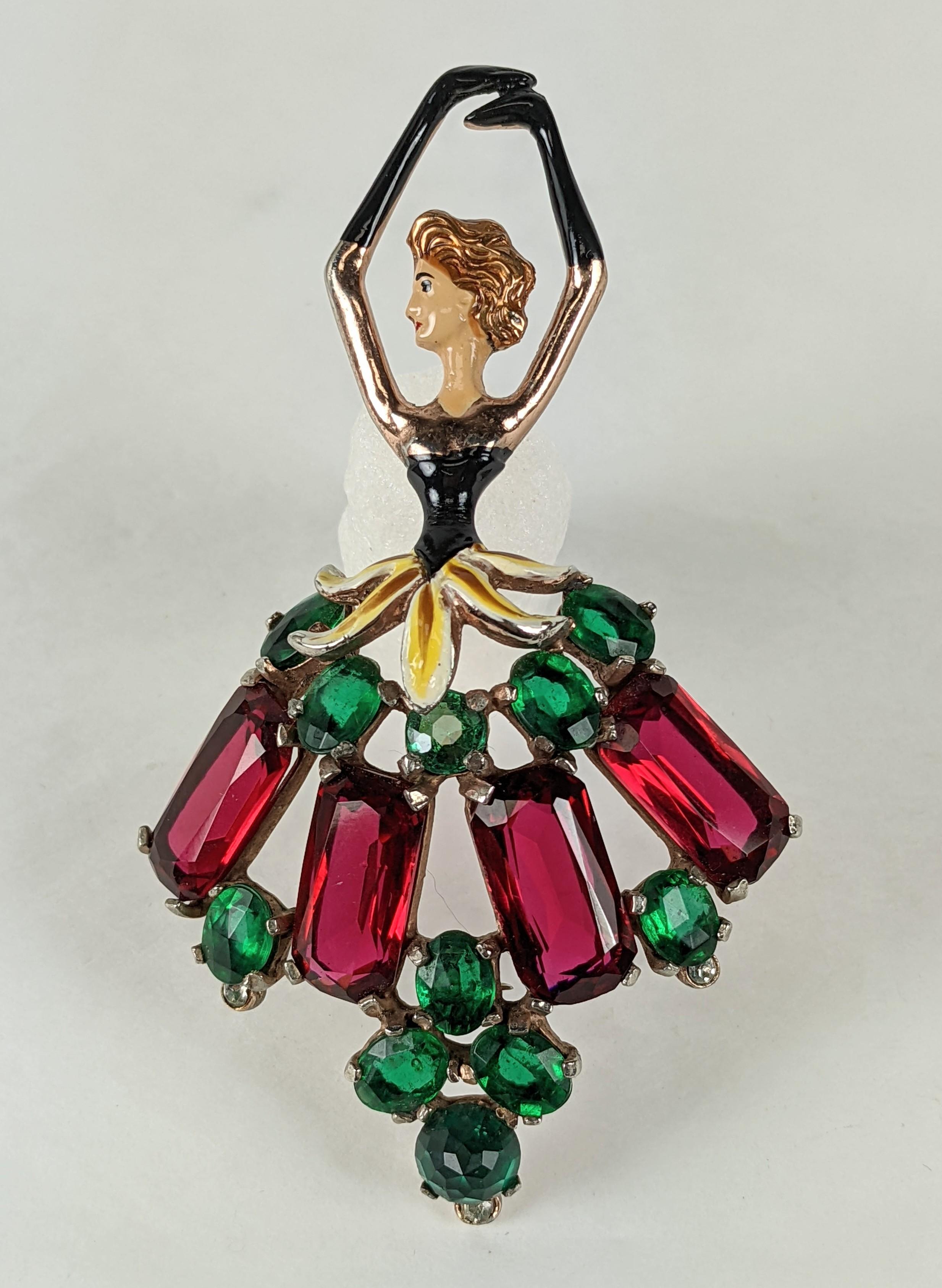 Charming Fred Block Art Deco Ballerina Brooch with enamel accents and large stones forming the skirt in ruby and emerald. Oversized wonderful figural Retro suit brooch.
Unsigned. 1940's USA.   3.75
