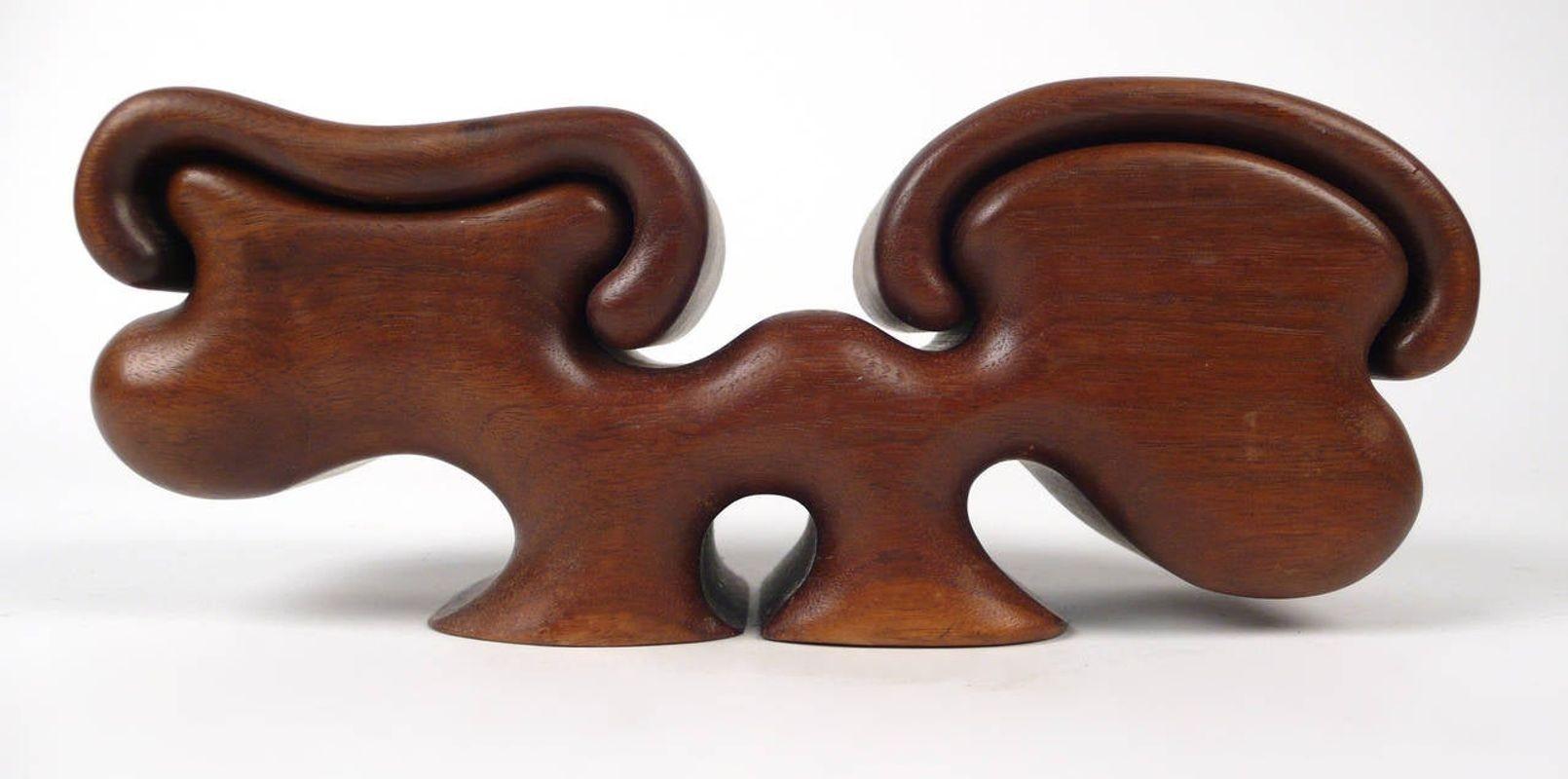 Fred buss black walnut puzzle box with felt lined interior compartments.
