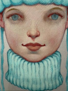 "Pom Pom" girl with bright blue eyes wearing a turtleneck and tall blue hat