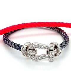 Fred Force 10:: besetzt mit Diamanten im Brillantschliff:: mit rotem und blauem Kabelarmband