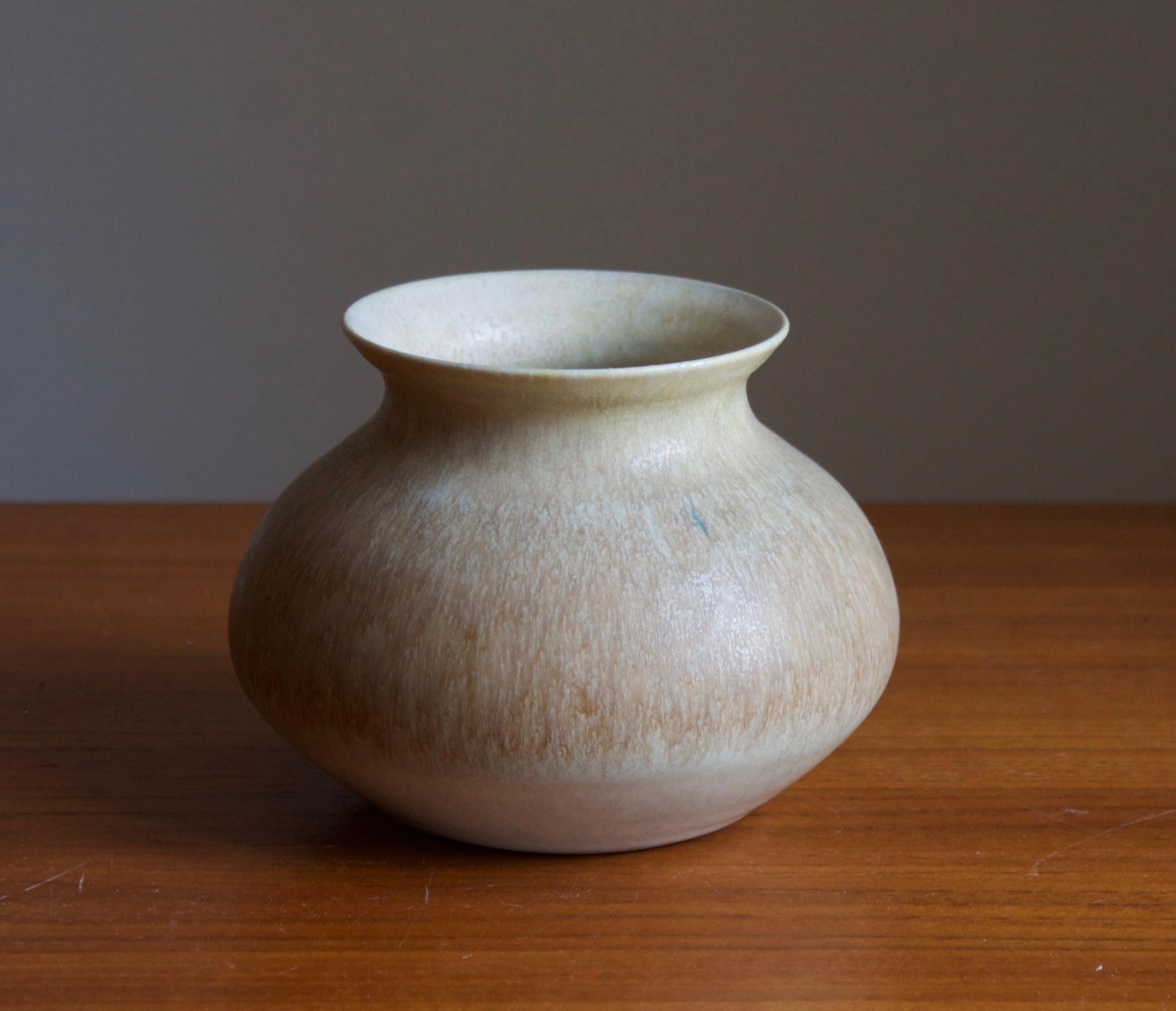 A small vase, designed and produced by Fred Forslund, Studio, Sweden, 1978.