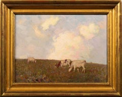 Cows grazing on a hillside