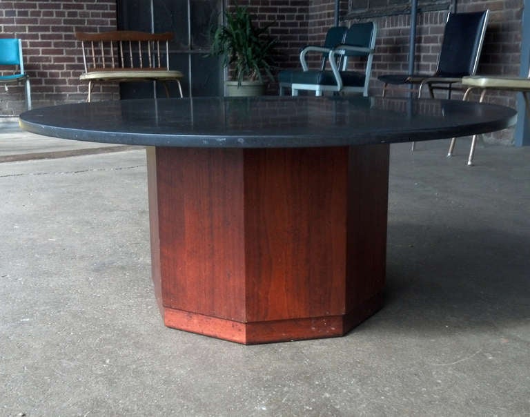 Round 1 inch thick slate topped cocktail or coffee table with octagonal walnut base by St. Louis architect, Fred Kemp. Kemp was a leading figure in the St. Louis architectural scene for over 50 years. He has designed some of that city's most