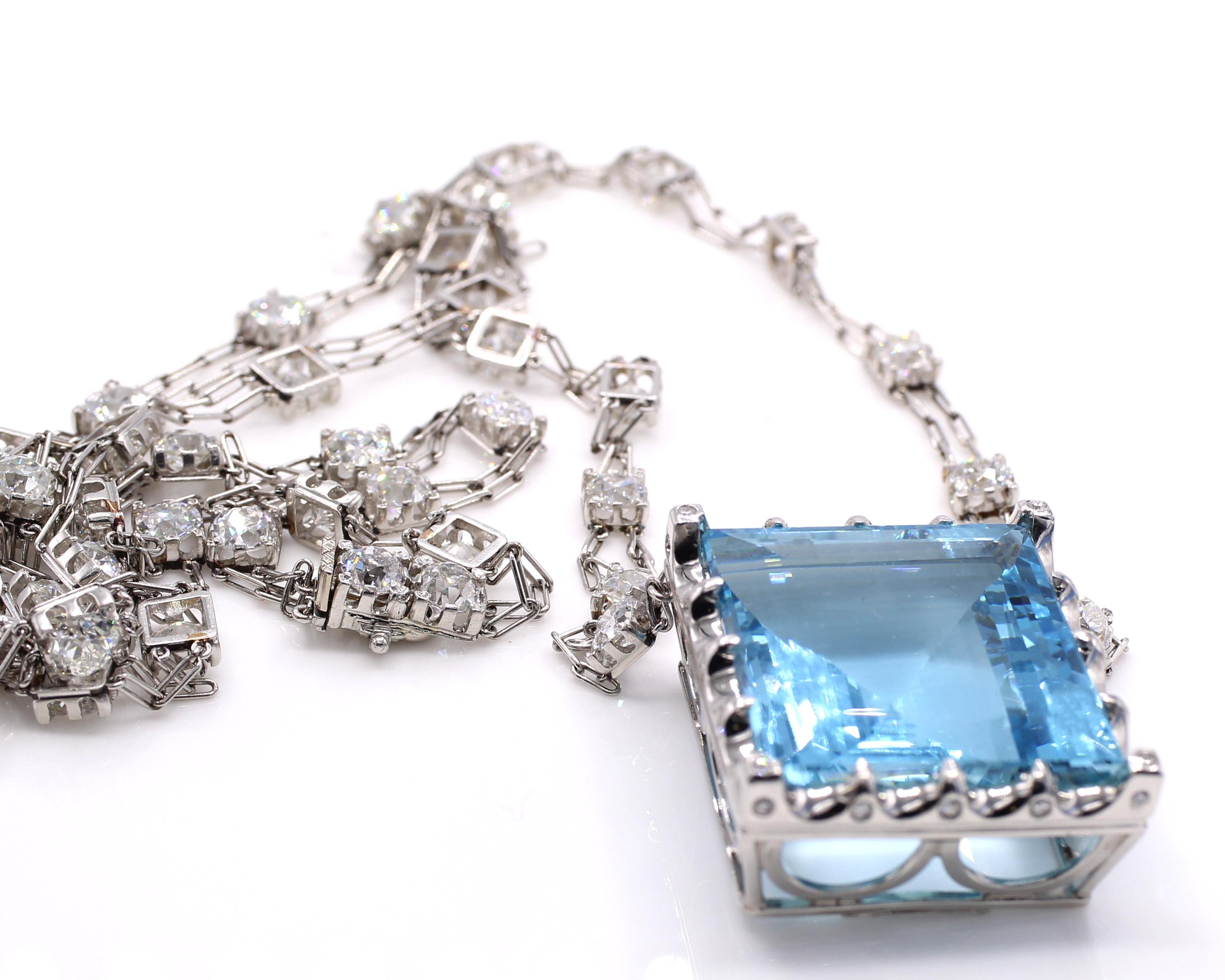 Impressive platinum necklace manufactured by the renown New York jeweler Fred Leighton showcasing an amazing Santa Maria blue aquamarine weighing approximately 85 carats. All set in platinum with a 30 inch chain spaced by 42 Old European Cut