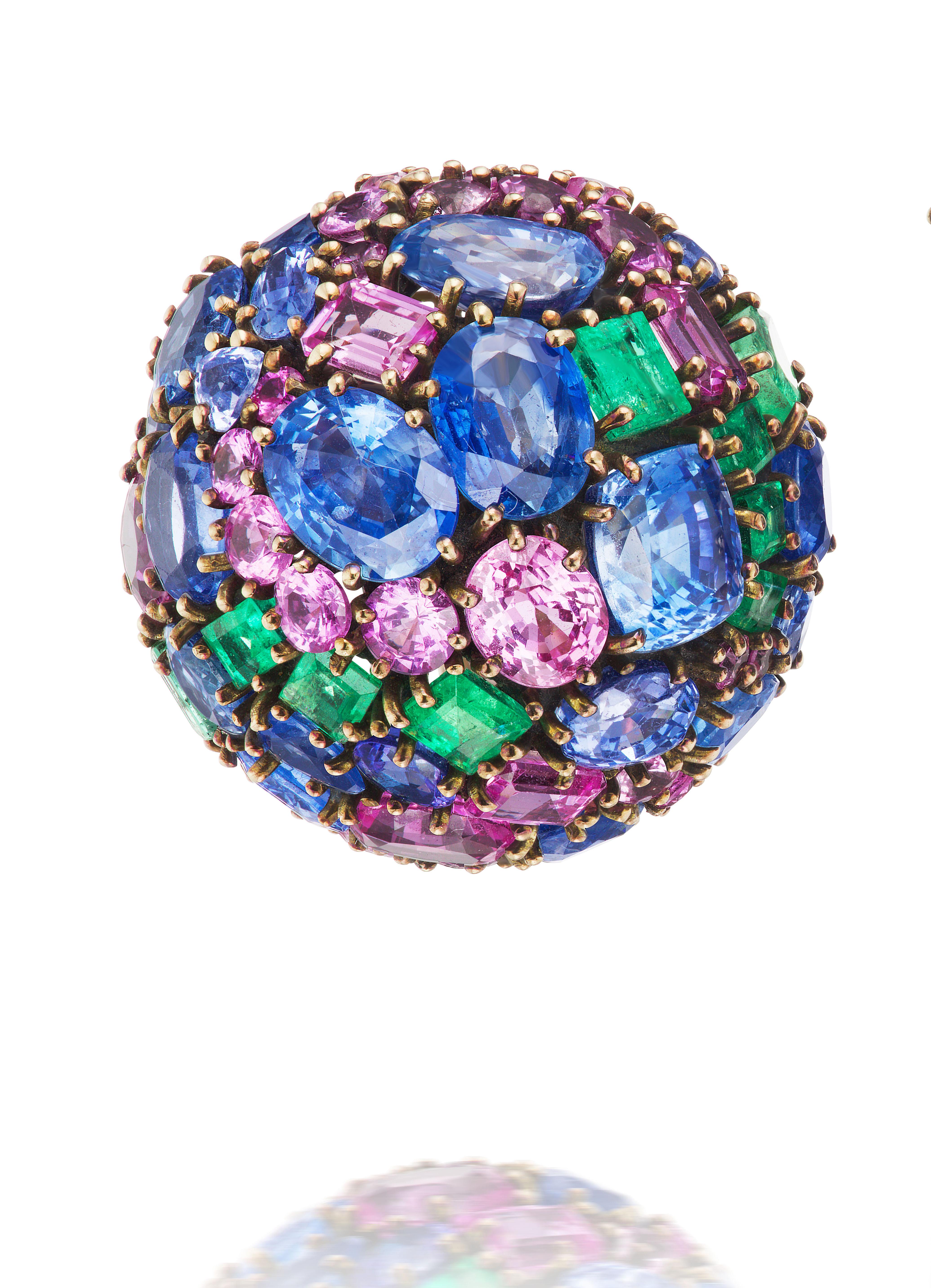 These substantial multi-gem bombé earclips by Marilyn Cooperman for Fred Leighton embody period charm with a wonderfully crafted whorl pattern in 18K gold and silver.

Sapphires weighing approximately 28.70 carats.
Emeralds weighing approximately