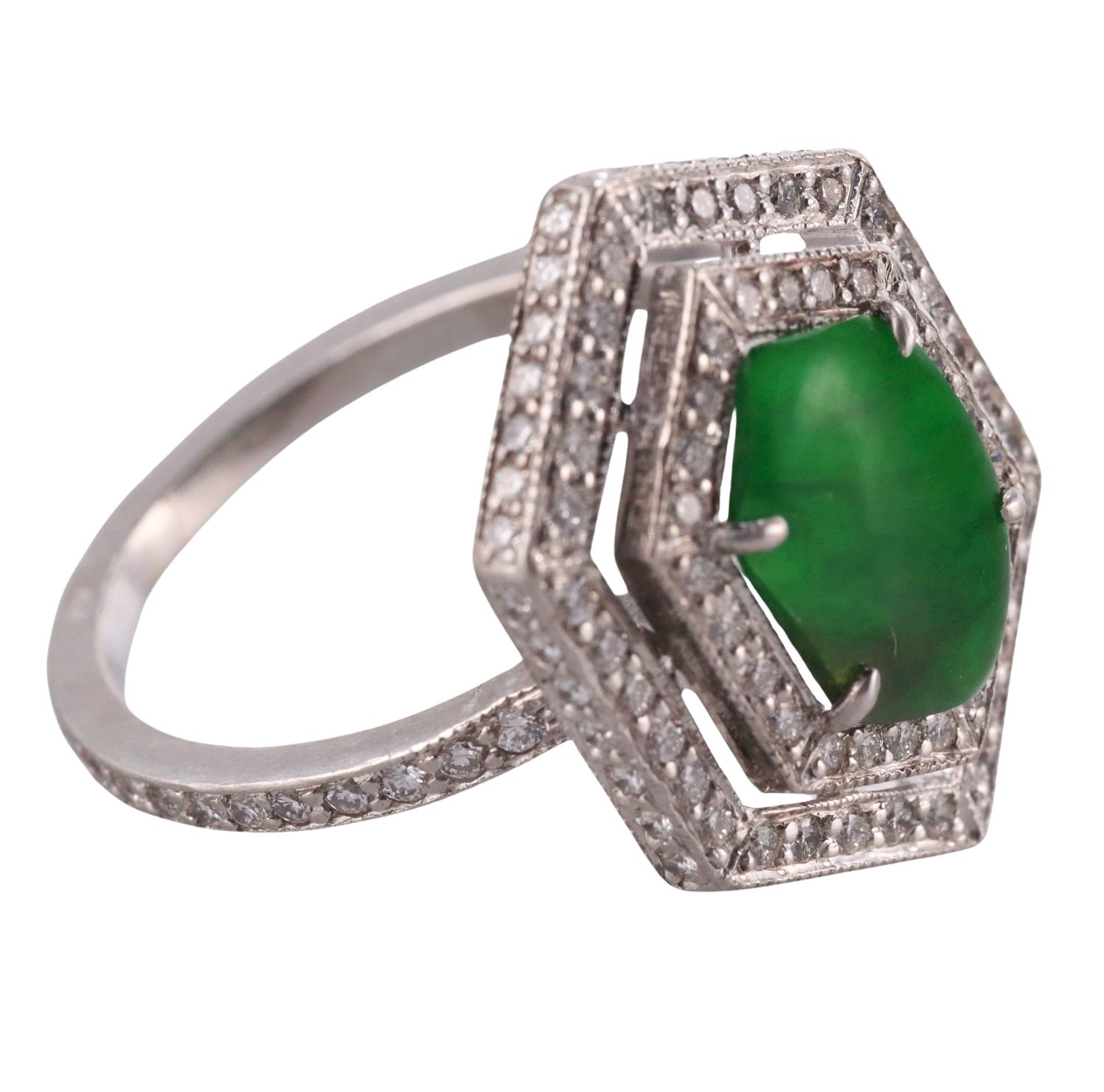 Exquisite and delicate creation by Fred Leighton, set in platinum, the ring features center 10.7 x 7.2mm jade, surrounded with approx. 0.60ctw G/VS diamonds. Ring size 6, top is 20mm x 15mm. Marked pt850, Fred Leighton. Weight - 7.1 grams. 