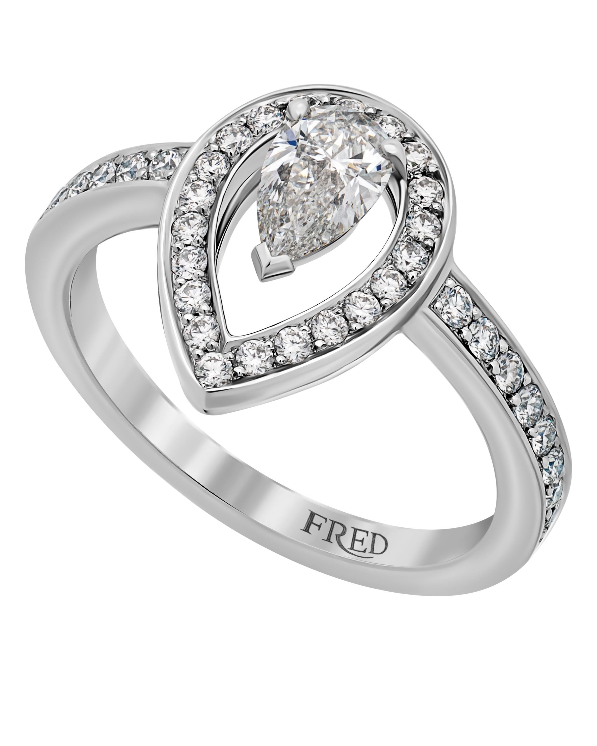 FRED Lovelight platinum engagement ring features a GIA certified 0.31ct. pear cut diamond center with color and clarity: E, VVS1 shimmering with 0.37ct. tw. pavé diamonds. The ring size is 5.25 (50.0). The weight is 4.13g.
