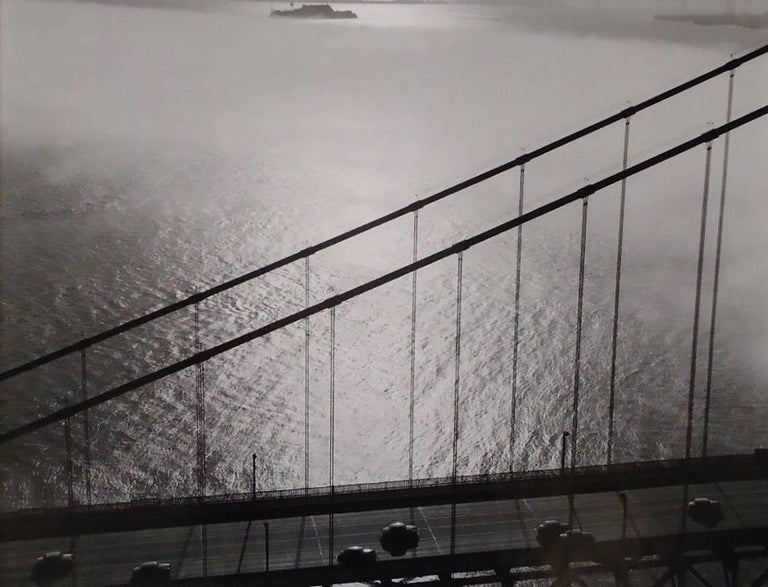 Fred Lyon Black and White Photograph - Golden Gate Bridge section aerial with Alcatraz near Upper Border