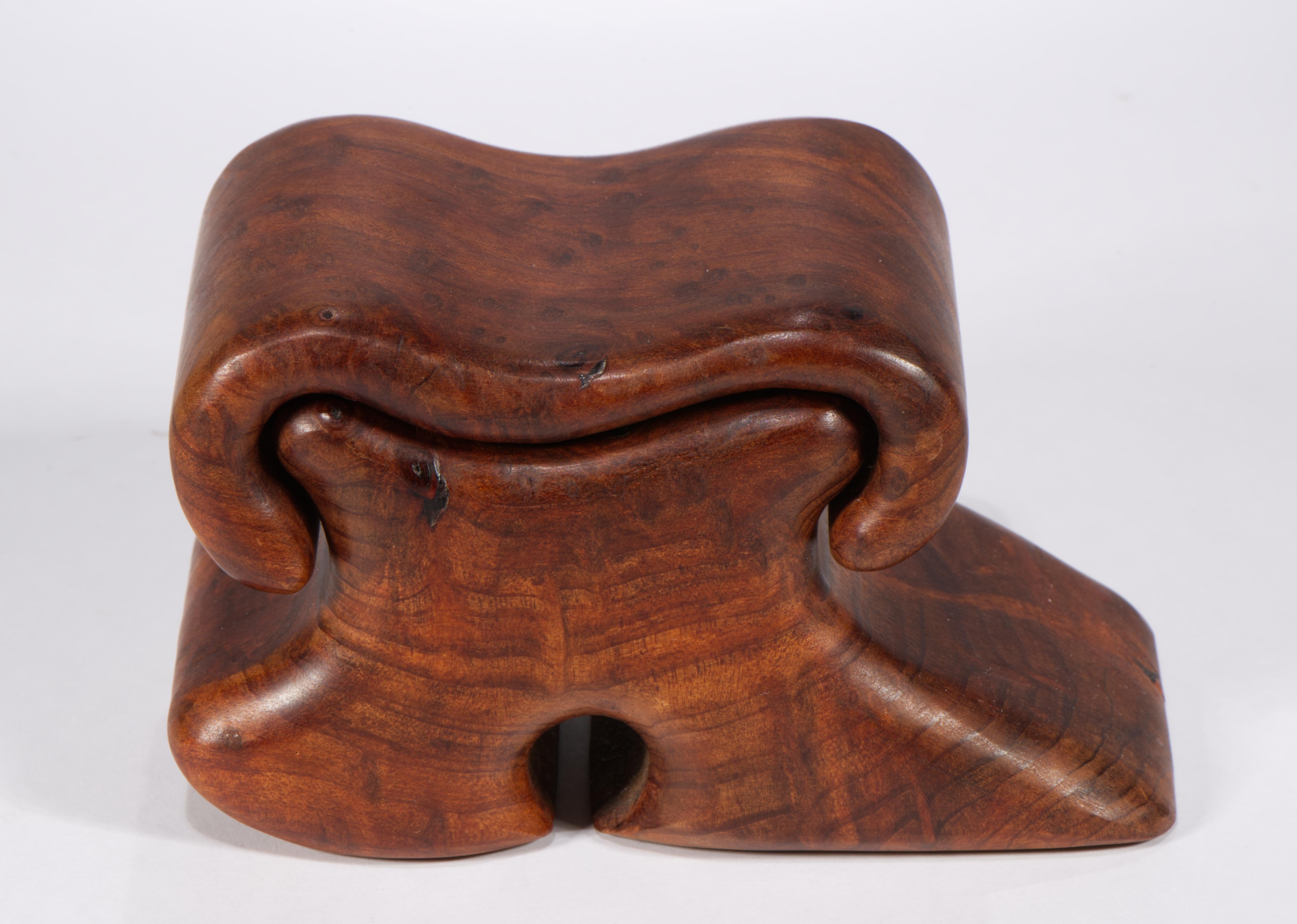 Vintage carved wood box features Modernist abstract organic form and striking choice of solid wood. Asymmetrically sculpted box is covered with a rounded lid, lined with felt fabric to prevent friction. Minimal, Organic Modern lines of the piece