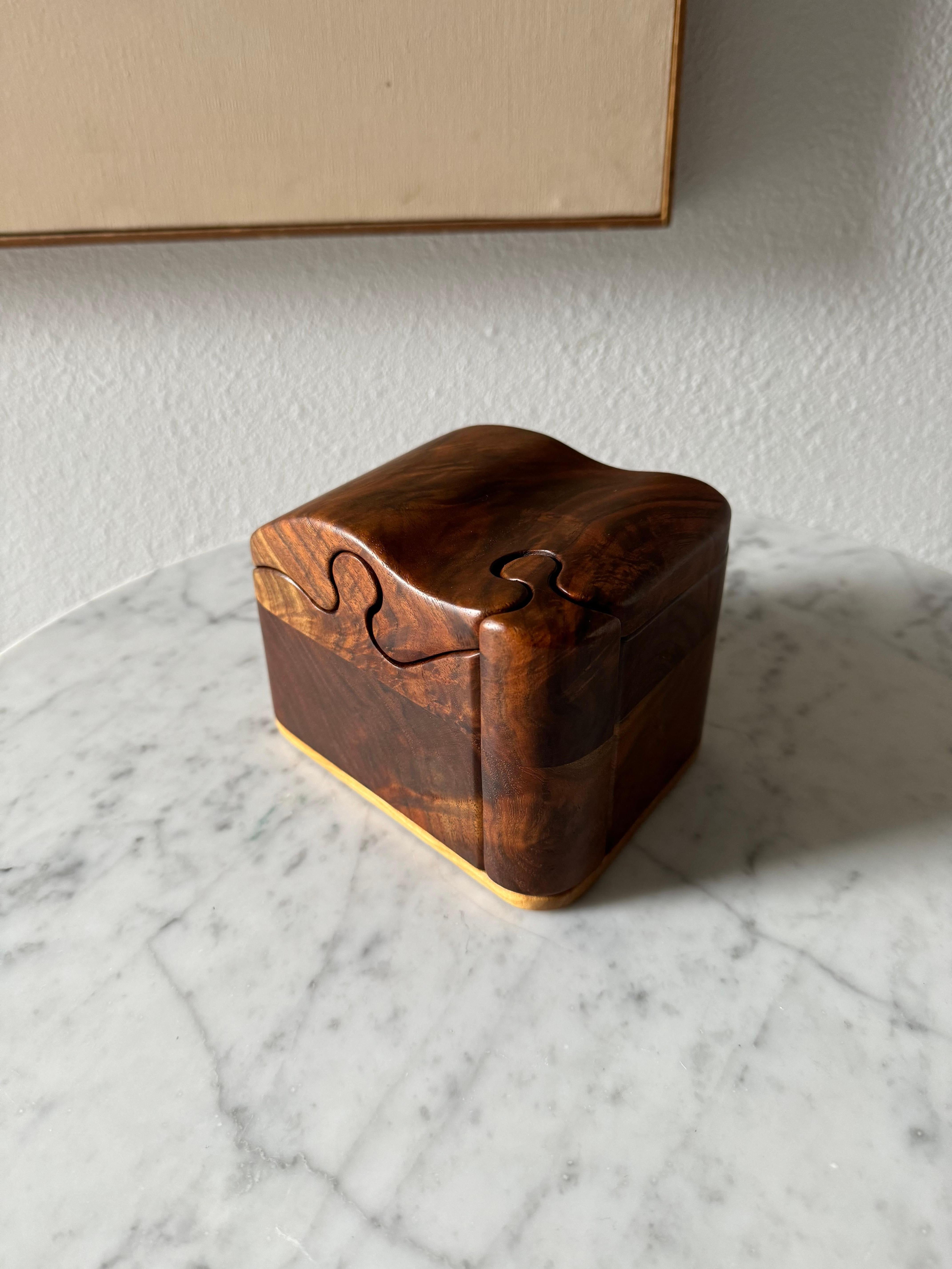 Fred & Marilyn Buss Trinket Puzzle Box, 1970s 
Made of black walnut and maple , comes with original paperwork . 