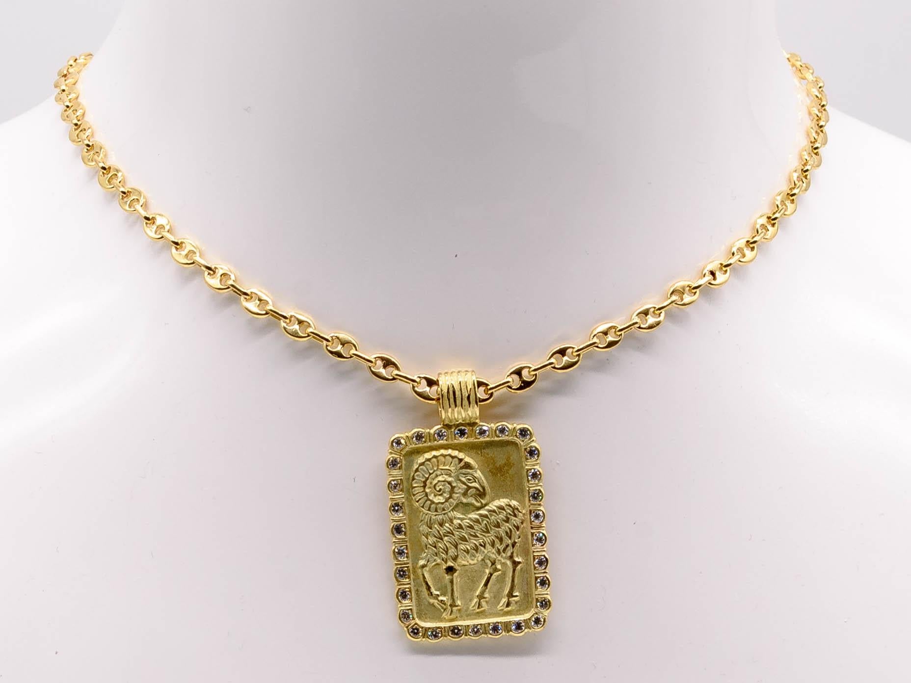 A beautifully crafted rectangular pendant depicting the astrological symbol for Aries the ram,  his horns beautifully spiraling across the top of the jewel.  The rectangle is framed with small round diamonds totaling close to 1 ct,  and the