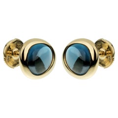 Fred of Paris, clous d'oreilles en or jaune et topaze bleue