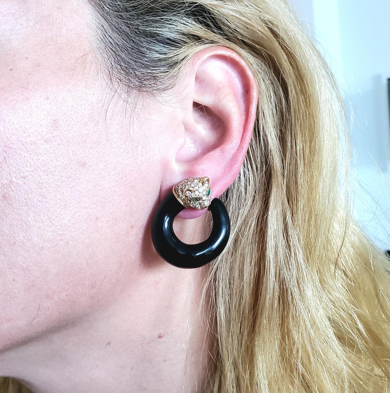Panther clips earrings designed by Fred of Paris.

Beautiful pair of rounded panthers clip-on earrings, created in Paris France by the jewelry house of Fred Joaillier, back in the late 1970's. This gem set pair has been crafted in the shape of