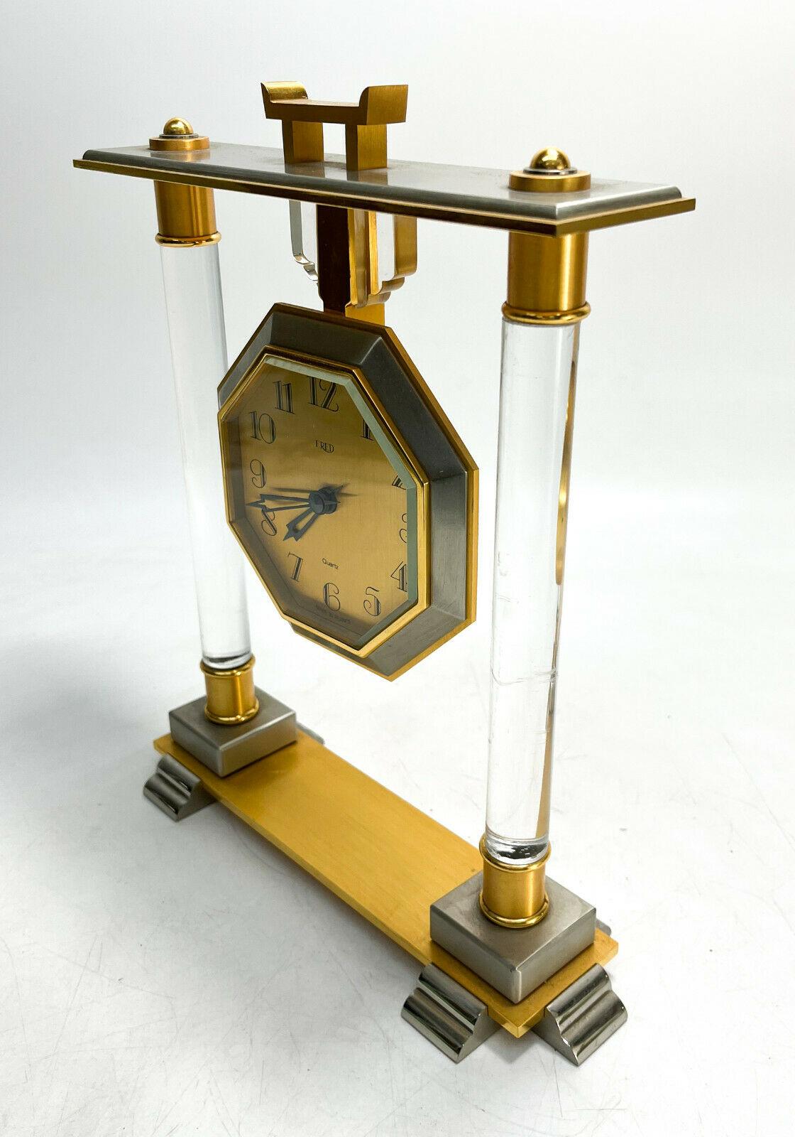 Fred of Paris Gilt silver plated and Acrylic Modernist Clock #1397

Mid Century. Acrylic to the columns. Marked Fred to the face of the clock and French marks and numbers to the underside.

Additional Information:
Brand: Clock 
Type: