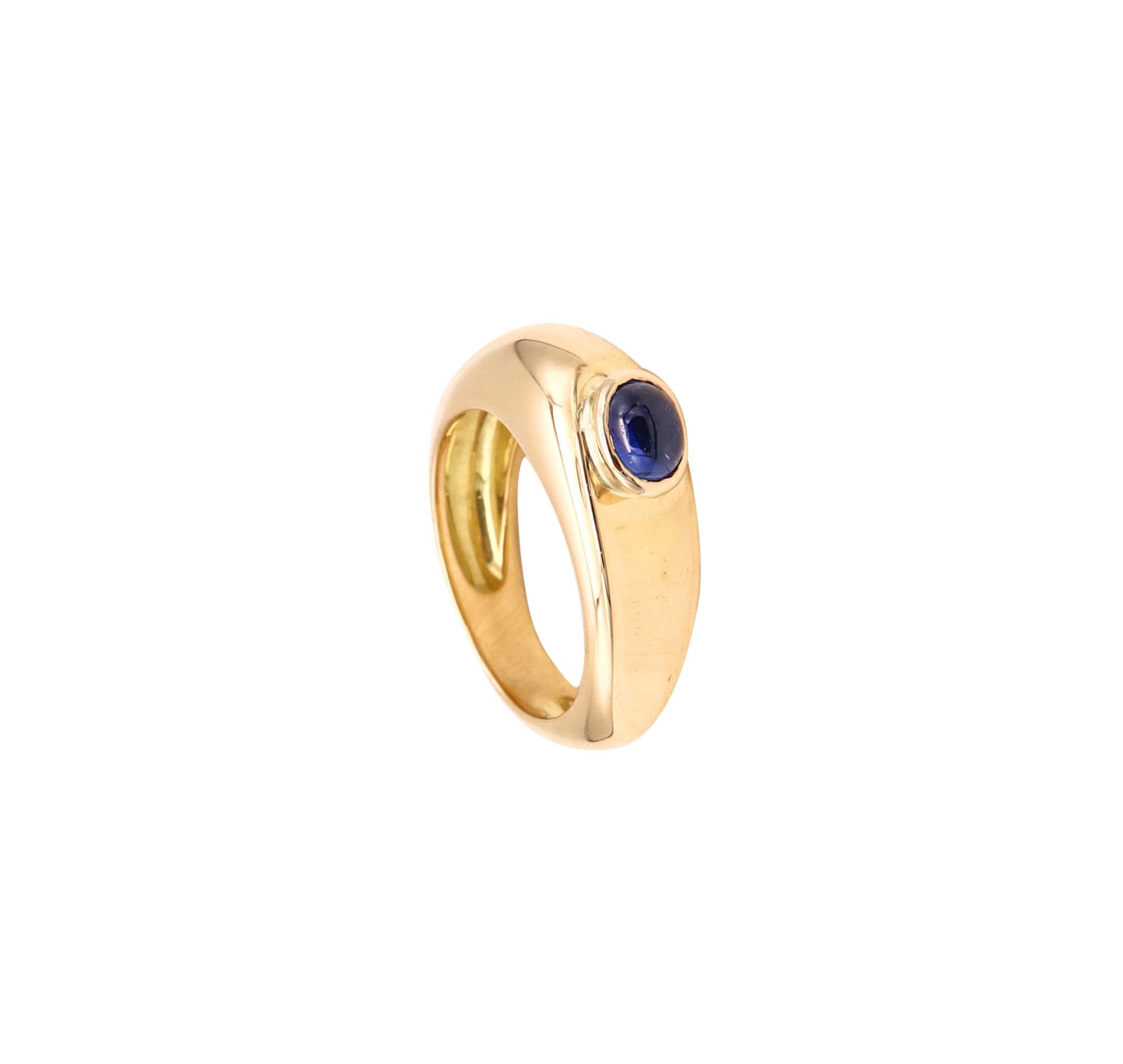 A ring with a sapphire designed by Fred.

Beautiful geometric piece created in Paris, France by the house of Fred, circa 1980's. It was crafted in solid yellow gold of 18 karat, with high polished finish.

Bezel set on top, with an oval cabochon cut
