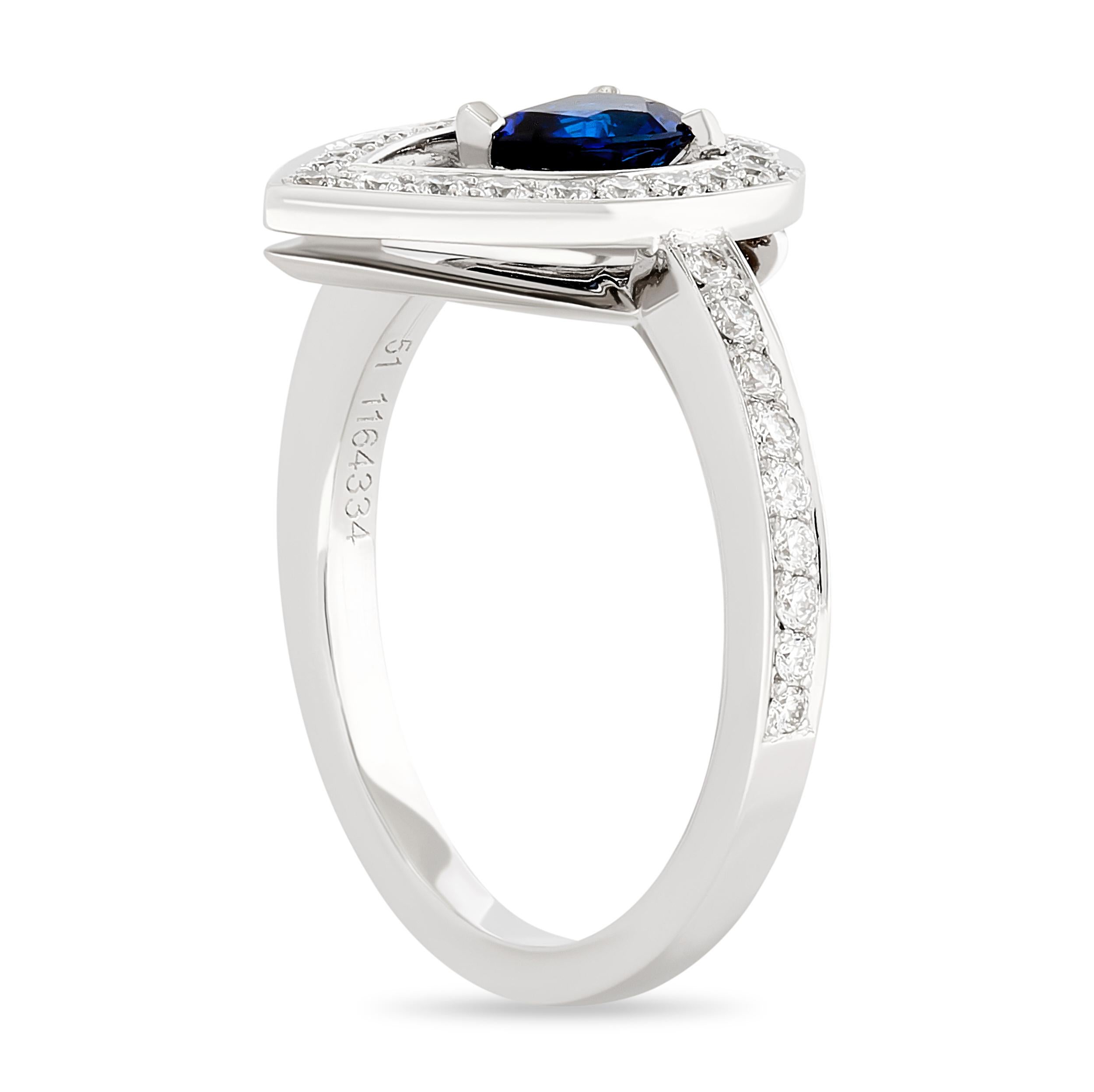 This Fred of Paris Lovelight ring has a bright blue pear shape sapphire at the center of a larger pear shape diamond halo on a diamond band. 

The pear sapphire weighs approximately 0.46 carat. There are 39 round diamonds that weigh approximately