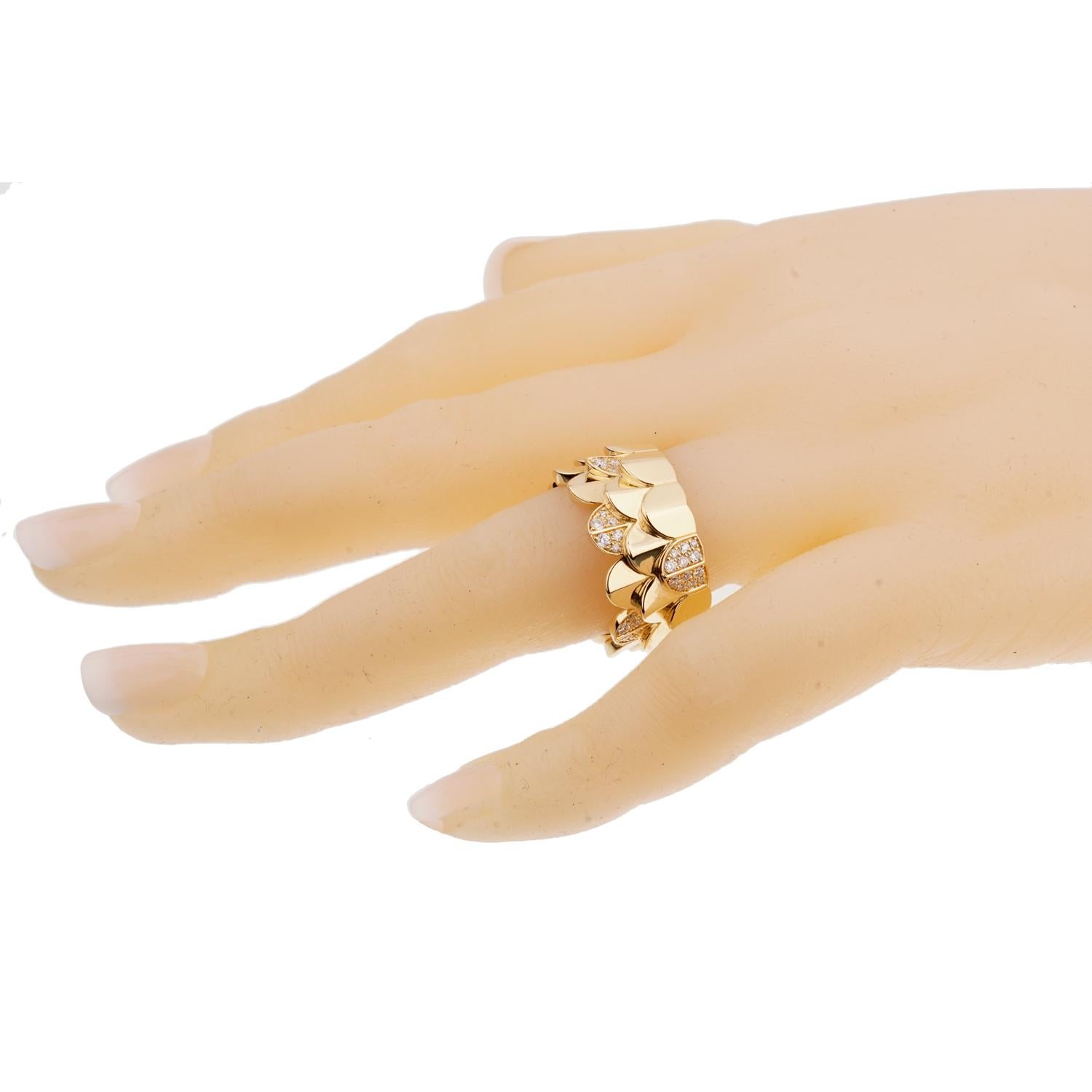A fabulous brand new Fred of Paris ring adorned with (.49ct) of finest round brilliant cut diamonds a triple arc motif in shimmering 18k yellow gold. The ring measures a size 53 / us 6 1/2, and measures .43